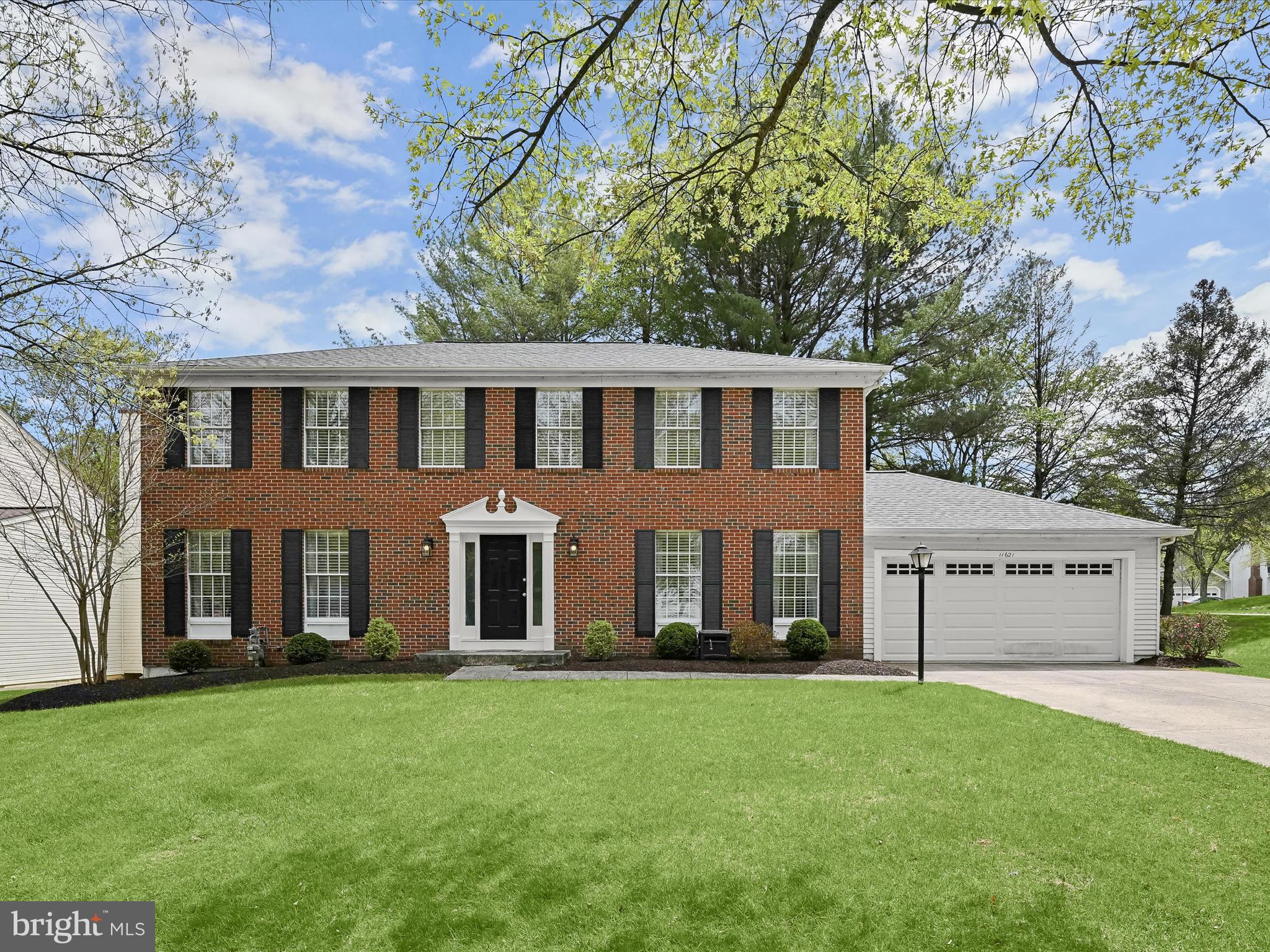 Beautiful brick-front colonial tucked away on a quiet cul-de-sac in one of Columbia’s most sought-after communities! This spacious home features thoughtful updates throughout, including a remodeled kitchen and bathrooms, and offers an ideal blend of comfort, style, and functionality.  The main level showcases rich wood flooring, accent molding, and recessed lighting, with formal living and dining rooms, and a cozy family room that opens to an expansive deck—perfect for indoor-outdoor living. The remodeled gourmet kitchen is a chef’s dream, boasting an oversized island breakfast bar with pendant lighting, granite countertops, tile backsplash, and stainless steel appliances including dual wall ovens.   Upstairs, the primary suite impresses with a walk-in closet and a luxurious spa-inspired bathroom featuring a dual granite vanity, a soaking tub, and an oversized frameless glass shower. A second bedroom adjoins the primary suite, offering flexible use as a nursery, office, or private sitting room. Three additional bedrooms and a full hall bath complete the upper level.  The finished lower level provides a spacious recreation room and a large storage area with a bath rough-in—ready to customize to suit your needs.  Enjoy outdoor living on the expansive deck with built-in seating, and take advantage of the prime location near major commuter routes, as well as abundant shopping, dining, and entertainment options.