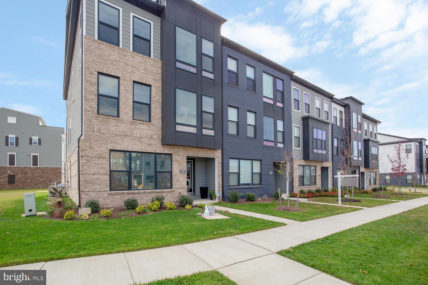 Please ignore DOM, home was under contract for months and buyer ultimately didn't perform.
VACANT and available for immediate possession.   Welcome to 302 Summit Point Blvd, Bowie, MD 20716 – a stunning, brand-new luxury townhome that perfectly combines modern design and convenience! This home features a unique contemporary exterior with sleek black frame windows and offers an entry-level rear rec room, plus the option for an additional bedroom or storage space. The open-concept main level boasts a gourmet kitchen with a sprawling 13 ft. island, ideal for entertaining, as well as a dining room and great room with two sliding glass doors that lead to a rear terrace.

The luxury owner’s suite is a serene retreat with an attached full bath, and the spacious secondary bedrooms come with walk-in closets. Enjoy the coveted bedroom-level laundry for added convenience. The two-car rear entry garage and covered front entry make this home as practical as it is stylish. Neighborhood amenities include a community center and a beautiful in-ground pool, perfect for relaxation. With easy access to Liberty Sports Park and built in 2022, this home has it all—schedule your tour today and experience luxury living at its finest!
