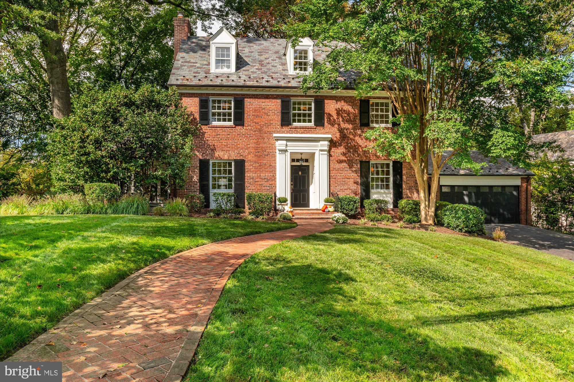 Discover your dream home in the highly desirable Rollingwood neighborhood of Chevy Chase! Nestled on a charming corner lot, this classic 1940s colonial seamlessly combines timeless elegance with modern amenities. Surrounded by mature trees and lush landscaping, this five-bedroom, four-and-a-half-bathroom home offers the perfect balance of comfort and character.  Inside, you'll find beautifully restored oak wood floors throughout, a stately center hall, a gracious living room, and a formal dining room perfect for entertaining. Relax in the serene, screened porch featuring flagstone floors, or cook up a storm in the updated kitchen, complete with quartz countertops, a stylish white tiled backsplash, and brand-new stainless-steel appliances. The adjoining family room creates a cozy, open space, and there is also a lovely den off the kitchen that can double as a home office. The large two-car garage provides ample storage.
The second floor boasts three spacious bedrooms, including a generous primary suite. The third-floor features two additional sun-filled bedrooms and a recently updated hall bath. The fully finished lower level offers extra living space, with a recreation room, utility area, laundry room, and a bonus room complete with a full bathroom.  Additional features include a brand-new zoned HVAC system for the third floor, a durable slate roof with copper gutters, and a full irrigation system to maintain the pristine yard. With its prime location near Candy Cane City, Rock Creek Park, Brookville Market, and local shops—and just a mile from the Bethesda Metro—this home offers both convenience and charm.  With its thoughtful updates, classic craftsmanship, and unbeatable location, this is truly the forever home you’ve been dreaming of!