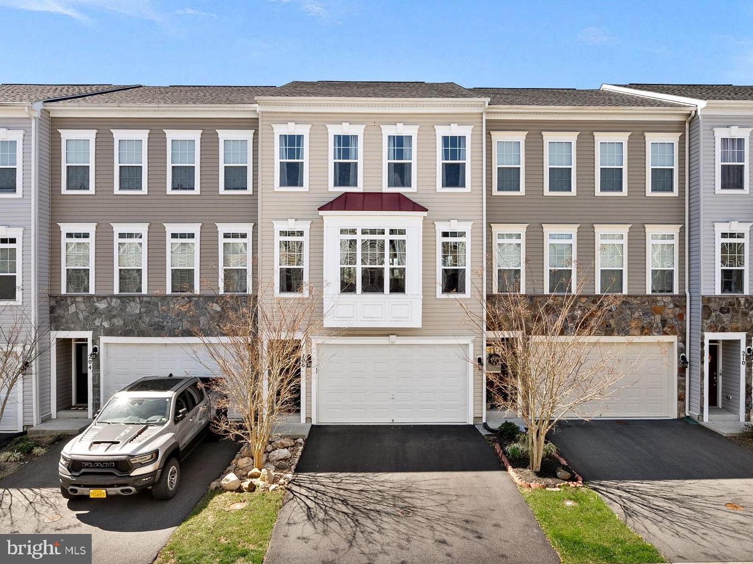 Welcome to this meticulously maintained townhome located in the desirable Mayfair community of Purcellville! Boasting over 2,600 square feet of beautifully finished living space, this 3-bedroom, 3.5-bathroom townhome with 2-car garage is a true gem. Built in 2019, this gorgeous home features countless upgrades throughout!!  

The main level features a bright and open layout ideal for entertaining. Gather around the sleek, built-in entertainment center with huge TV that conveys, and an elegant fireplace. Or enjoy meals in the spacious kitchen complete with granite countertops, stainless steel appliances, custom backsplash, and a thoughtfully designed pantry. Just off the kitchen, step out onto the Trex deck and take in serene views of the community pond and tree line—Blue Ridge Mountain sunsets are the perfect backdrop.

Upstairs, the primary suite offers a peaceful retreat with scenic views, dual custom walk-in closets, a decorative grid accent wall, and a spa-like bathroom featuring ceramic tile, a soaking tub, frameless shower, and dual vanities. Two additional bedrooms—one with its own walk-in closet—along with a full hall bath and a separate laundry closet with full-size washer and dryer complete the upper level.

The walk-out lower level provides endless possibilities with a full bath, ample storage, and a flexible open space—ideal for a home office, gym, rec room, or guest space. The fully fenced backyard and patio are just the cherry on top.

This home is move-in ready and waiting for you—schedule your private tour today!