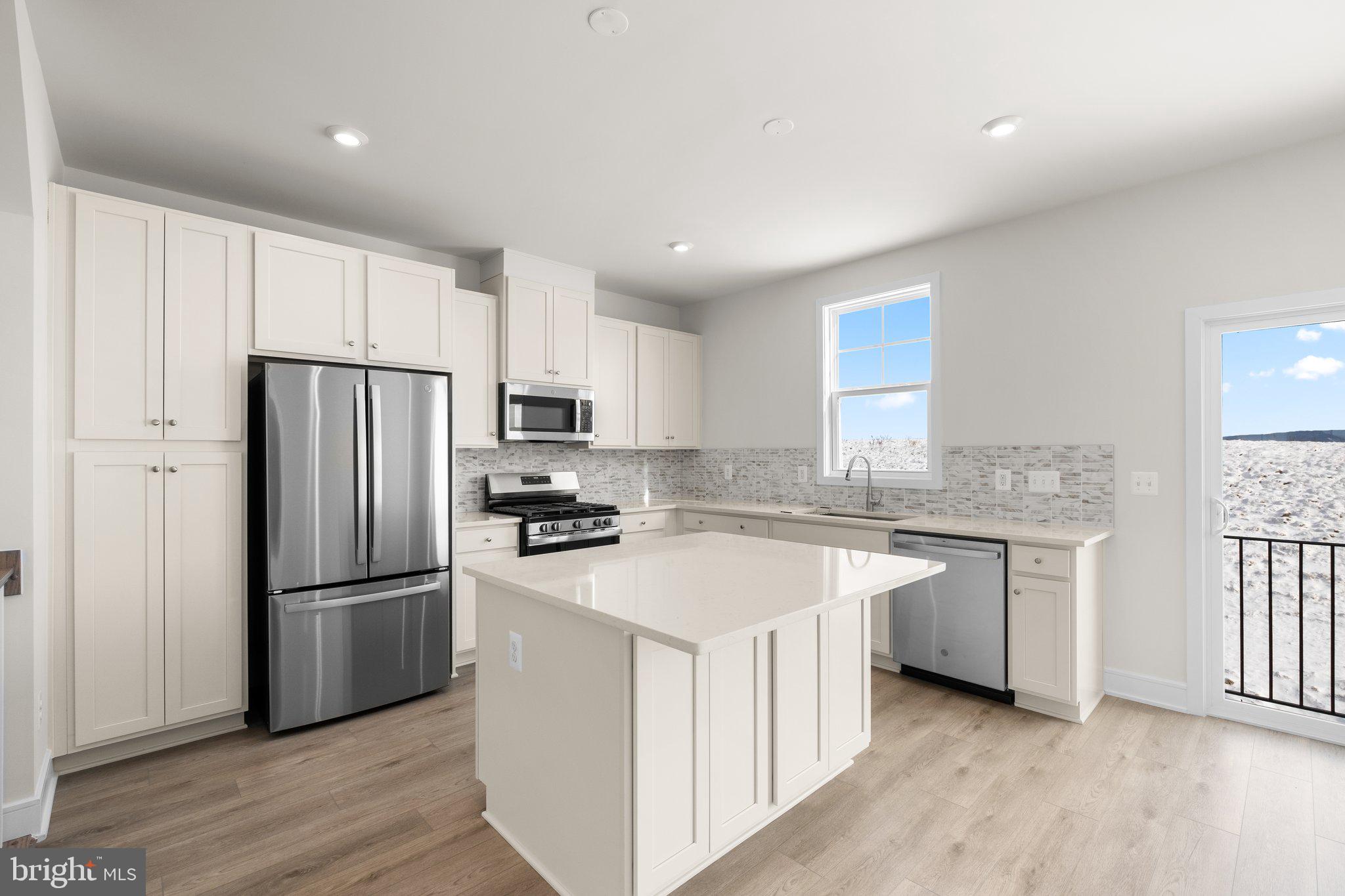 Say hello to your new home! This brand-new END UNIT TOWNHOME is ready for you to move in IMMEDIATELY! Step into contemporary luxury with the captivating SUGARLOAF floorplan by Van Metre Homes at LAKE FREDERICK. Spanning 2,124 finished square feet across three meticulously crafted levels, this exquisite townhome offers an unparalleled blend of style, comfort, and convenience. Boasting three bedrooms, three full and one half bathrooms, and a convenient 1-car front load garage, this residence is designed to exceed expectations at every turn. As you step inside, you're greeted by a meticulously crafted living space adorned with 9' ceilings, where the main level showcases a sprawling great room and dining area, seamlessly connected to a captivating kitchen featuring a central island, upgraded cabinets, tile backsplash, quartz countertops, and luxury vinyl plank flooring – the epitome of modern elegance and functionality. Venture to the upper level and discover a haven of relaxation in the impressive primary suite, complete with a generous walk-in closet and a luxurious 4-piece bathroom boasting double sinks and a frameless shower with a built-in seat – the perfect retreat after a long day. This level also hosts two additional bedrooms, another full bath, and a convenient upstairs laundry room, offering unparalleled convenience and comfort. Venture to the ground level and find a versatile multipurpose rec room and yet another full bath, providing ample space for relaxation and entertainment, with easy access to the private rear backyard, ideal for outdoor gatherings and leisure. Being a new build, your home is constructed to the highest energy efficiency standards, comes with a post-settlement warranty, and has never been lived in before! Don't miss out on this incredible opportunity to own a home that seamlessly combines modern luxury, thoughtful design, and a prime location, all at an unbeatable price. Schedule your appointment today! ----- Discover Lake Frederick, a charming community tucked in the serene Shenandoah Valley between Winchester and Front Royal. With its selection of townhomes and villas, Lake Frederick creates a perfect harmony between easy access to the great outdoors and a laid-back lifestyle centered around enjoying time with friends and having fun. With breathtaking mountain views just outside your door, this community boasts outstanding lifestyle amenities, including an award-winning farm-to-table restaurant, a community pool and clubhouse, tot lots, and miles of walking trails. End your days with family and friends while watching the sun set over the Blue Ridge Mountains. Moreover, Lake Frederick is conveniently located minutes away from major interstates like I-66 and I-81, ensuring seamless connectivity to the region. Embrace the sun-drenched life and the joys of natural beauty at Lake Frederick, where an exceptional community experience awaits. ----- Take advantage of closing cost assistance by choosing Intercoastal Mortgage and Walker Title. ----- Other homes sites and delivery dates may be available. ----- Pricing, incentives, and homesite availability are subject to change. Photos are used for illustrative purposes only. For details,  please consult the Community Experience Team.