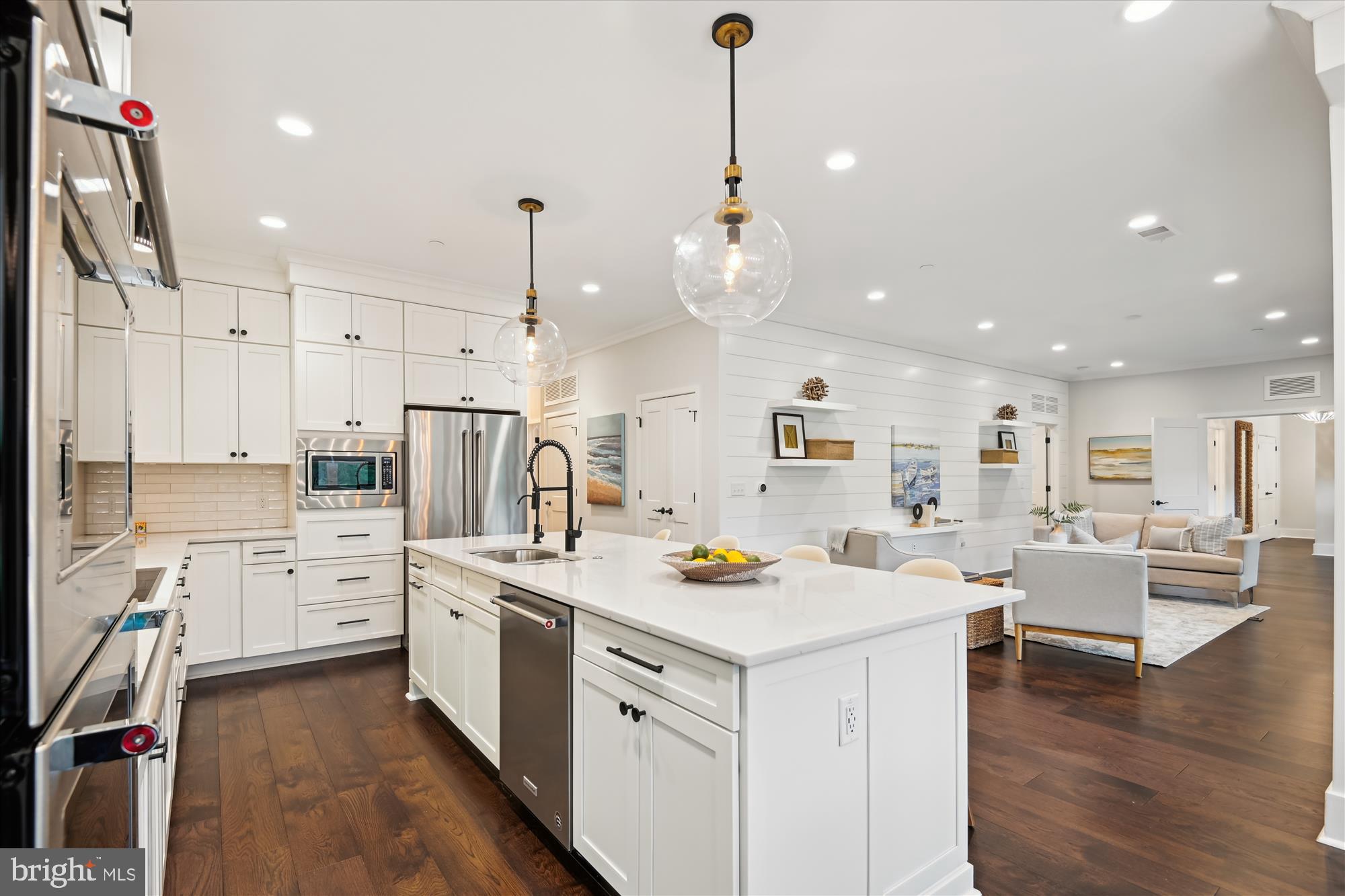 Custom Luxury in Downtown Annapolis — Over 2,100 Sq Ft of High-End Living at West141

Welcome to Unit 304, the premier residence in the boutique West141 building and the only unit created by combining two original floor plans into one expansive home. With over 2,100 square feet of thoughtfully designed space, this is downtown Annapolis condo living at its most refined.

Originally configured as a 3-bedroom, 3-bath layout, this home has been expertly redesigned to enhance both style and function. The spacious primary suite features its own private balcony, a seating area, a spa-inspired bath with double vanity, soaking tub, and oversized walk-in shower, and a large walk-in closet with custom California Closet built-ins. The second bedroom includes a private ensuite bath, perfect for guests. The third bedroom has been transformed into a high-end office with over $17,000 in custom cabinetry, shelving, and a built-in desk.

Off the main living area, a flexible bonus space provides the perfect zone for a home gym, reading lounge, or guest accommodations with a sleeper sofa or Murphy bed. And for any additional guests, the luxury Graduate Hotel is located directly across the street.

The kitchen is a showstopper—featuring an oversized quartz island with bar seating, stainless steel appliances, crisp white cabinetry, and designer lighting—all opening to a sunlit living and dining area accented by shiplap walls and custom built-ins.

Stylish and functional upgrades include: over 2,100 sq ft of interior space • custom-built office • three California Closet systems  • remote-controlled motorized shades • two private balconies (one off kitchen/dining, one off primary suite) • spacious primary suite with spa-like bath and seating area • shiplap accent walls  • oversized kitchen island with quartz counters and bar seating • stainless appliances and shaker cabinetry • flexible bonus space for gym, guest, or den • second bedroom with private ensuite bath • separate laundry room with storage cabinetry • two secure garage parking spaces with a private storage unit • elevator building with controlled access • short-term rentals allowed • steps to dining, shopping, Naval Academy, and Navy Stadium • easy access to Route 50 for D.C., Baltimore, and weekend getaways.

Unit 304 is truly one of a kind—offering the space and feel of a home with the convenience of low-maintenance condo living, all in the heart of Annapolis. Whether you’re looking for a primary residence, a stylish weekend escape, or a flexible investment property, West141 delivers it all.

Welcome home.