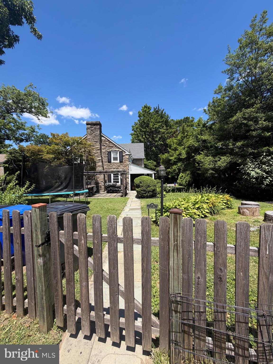 Welcome to this sun-filled and pristine, 4 bedroom, 3.5 bath, Stone, Colonial in the heart of beautiful Elkins Park.  A nice walkway leads you to the covered front porch to enter into this impeccable, remodeled home.  Enter into breath-  taking hardwood oak flooring and sun-filled windows through out this home.  Spacious living room completed with a Wood burning fireplace and stately mantel.  Light filled large dining room with a bay window to give a beautiful view.  A swinging Butler door leads to the updated kitchen  that features granite Counter Tops, stainless steel appliances, breakfast bar, and a large window above the sink.  Kitchen can also be accessed from the entry hallway.  Through the kitchen is a nice size mud room/ laundry room for your convenience.   There is also a powder room, coat closet and pantry along the way.  
On the way upstairs there is a middle landing with an original arched window and a cozy window seat.  Upstairs every bedroom offers at least two windows creating an airy feeling.  The large, spacious master bedroom offers lots of Space for bedroom furniture.  Master bedroom offers a walk in closet and Dressing area with a window, with an additional double wall closet for additional  space,   In-suite Master bedroom offers beautiful cobalt blue wall tile, an updated vanity, linen closet, and walk-in shower.  
There are two middle bedrooms which are both extremely spacious and share updated hall bathroom with tub/shower combination.  The fourth bedroom in the home can be used as a private suite if to your liking with its own full bath and shower.  This room is accessible to a rear staircase.  This would be perfect for in-laws, guests, or a home office.  Traveling back downstairs to the rear of the home is a cozy study with original built-in shelving and cabinets, through which you can access the spacious finished basement.  This basement is warm and welcoming with carpet and two windows the lots of Natural light.   Outside the home is beautifully landscaped, nice fenced yard,   Nice Pergola in backyard perfect for outdoor dining and entertaining.  A nicely painted Driveway, newer with, boiler and windows make for a turn-key home.  This beautiful home is situated  nicely within .5 Miles of downtown Elkins Park, where you can find the regional rail Station, Library, multiple parks, and bakeries.  Come  see this impeccable home right away!!