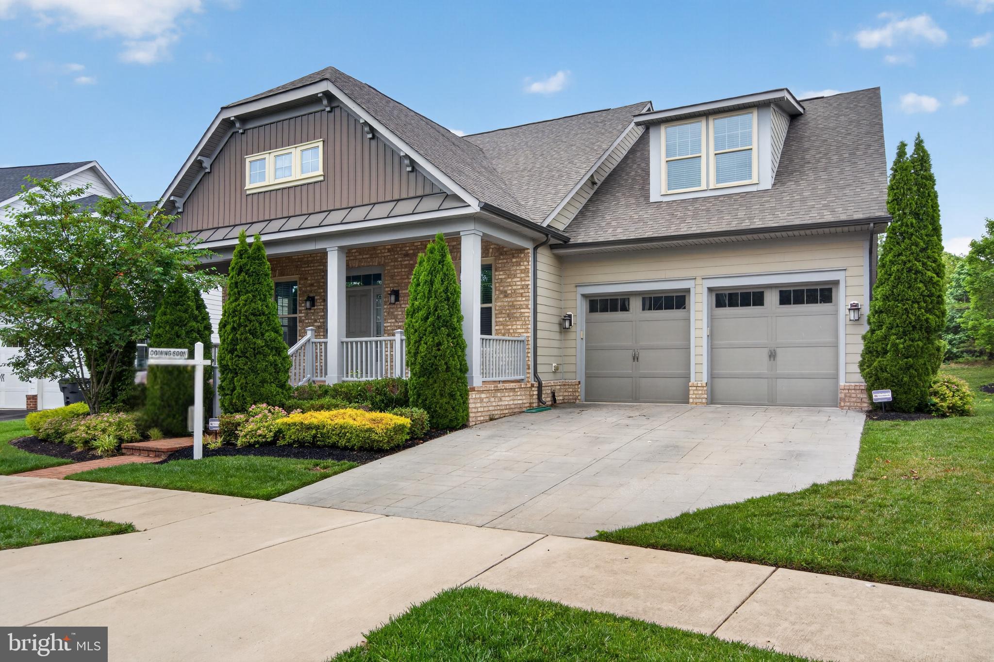 Nestled in the prestigious Potomac Shores community, this exquisite home embodies the pinnacle of luxury living. Built in 2016, this stunning Colonial-Bungalow hybrid offers a harmonious blend of modern elegance and timeless charm, with 4 spacious bedrooms and 4.5 bathrooms across an impressive 4,670 square feet of meticulously designed space. Step inside to discover an inviting open floor plan that seamlessly connects the gourmet kitchen to the family room, perfect for both intimate gatherings and grand entertaining. The kitchen is a chef's dream, featuring high-end appliances including a built-in microwave, gas range, and wall oven, complemented by elegant cabinetry and a generous breakfast area. Crown moldings and chair railings add a touch of sophistication, while the cozy gas fireplace creates a warm ambiance in the family room. Natural light floods the home through energy-efficient double-hung windows, enhancing the beauty of the ceramic tile and hardwood flooring throughout. The entry-level bedroom offers convenience and flexibility, while the luxurious master suite promises a serene retreat with views of the lush surroundings. Step outside to your private oasis, where the beautifully landscaped yard backs onto open common areas and wooded trees, providing a tranquil escape. Enjoy the outdoors from your screened porch, perfect for al fresco dining or simply unwinding with a book. The community amenities elevate your lifestyle further, featuring a sparkling in-ground pool, a state-of-the-art fitness center, and the option for golf course membership. Safety and convenience are paramount, with an electric alarm system and ample parking options including a two-car attached garage and driveway. The property is situated on a level lot in a peaceful suburban setting, ensuring privacy while remaining close to essential amenities. Experience the exclusive lifestyle that Potomac Shores offers, where luxury meets comfort in a picturesque environment. This home is not just a residence; it's a lifestyle choice that promises to elevate your everyday living. Don't miss the opportunity to make this exceptional property your own.