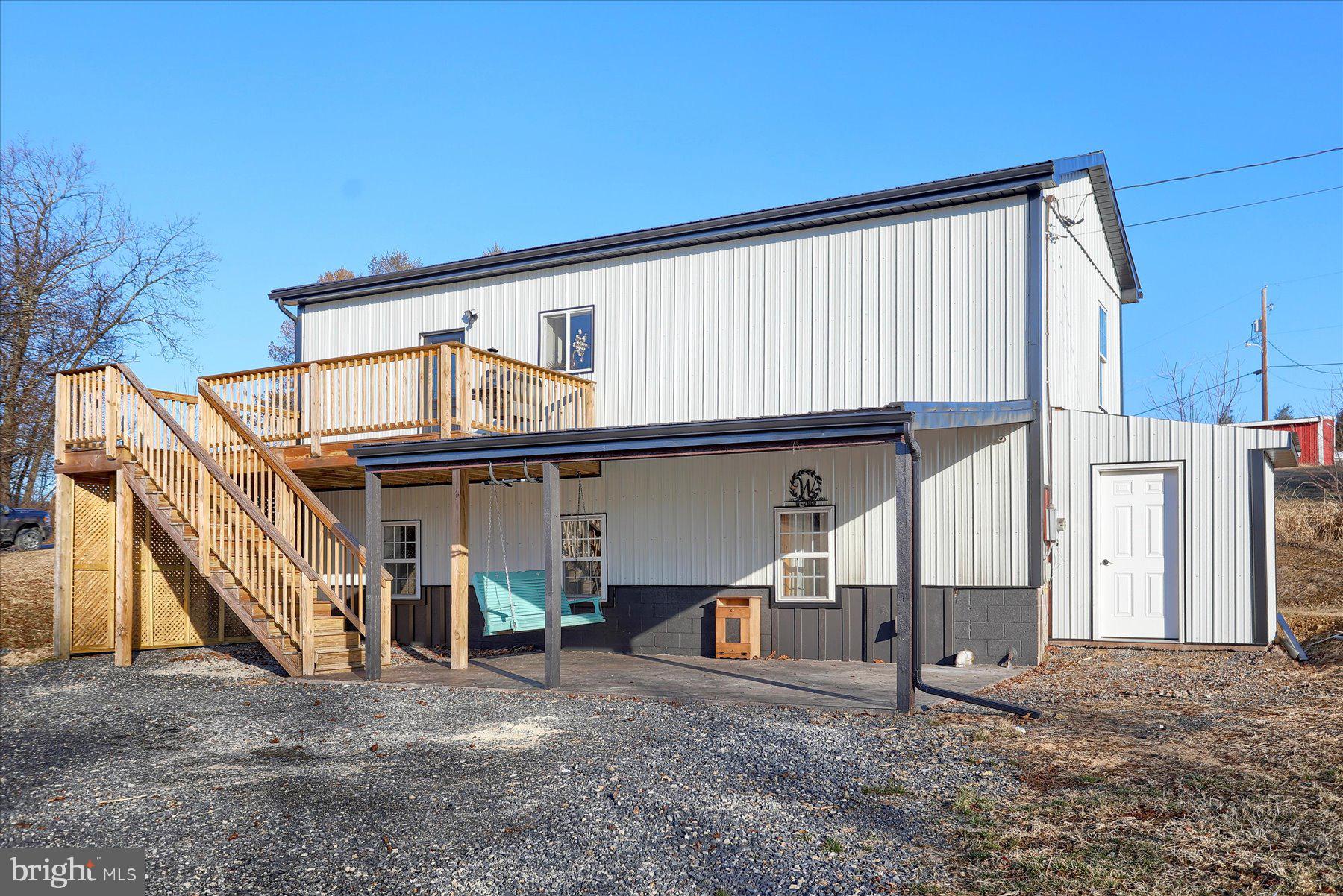 A barn? No........A house, Yes !!  A sweet "home" with 3 bedrooms 1 full and 1 half  bath.  Enjoy your coffee on the deck over looking  the fields.  Enjoy the summer sunshine with the family on the lower level patio.  A great room with vaulted ceilings just makes the kitchen/dining and living room all feel so spacious.  And outside storage sheds for added convenience.  Fisher Hill is the place to call home !
