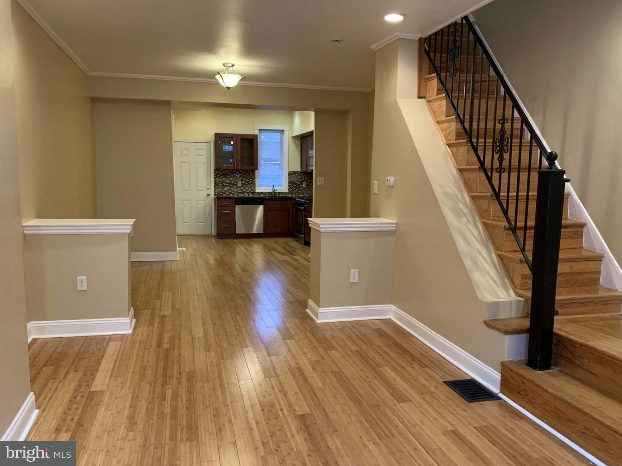This home is being sold as-is and offers a warm, modern feel in a prime location near the heart of Brewery town. Inside, you’ll find bamboo flooring throughout and spacious, open-concept living and dining areas, perfect for both relaxing and entertaining.

The kitchen features wood cabinetry, stainless steel appliances, and a custom glass backsplash. High ceilings and abundant natural light from large windows create a bright and airy atmosphere throughout the home. Upstairs, the property includes three comfortable bedrooms and one full bathroom. This well-maintained home is full of charm and ready for its next owner.