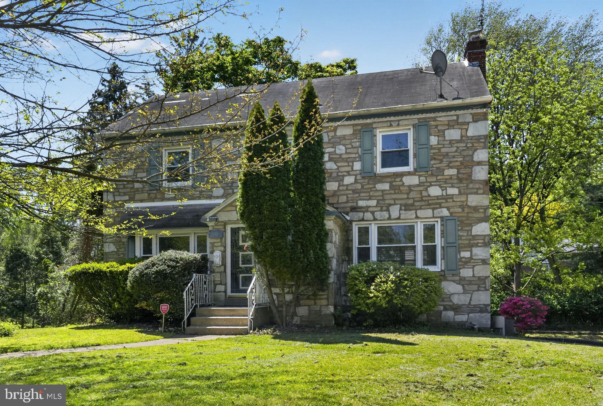 Solid brick and stone colonial on a corner lot in Cheltenham Township. Major systems already taken care of: new furnace and central A/C (2024), a year-old water heater, vinyl thermal-pane windows, and a refreshed kitchen with granite counters and marble floors. Three bedrooms and two full baths upstairs, plus a half bath on the main floor and another in the fully finished basement. The lower level adds multiple flexible living spaces beyond the official square footage. Original parquet floors throughout give the home real character. Outside, a concrete porch built for grilling and weekend BBQs sits on a 0.49-acre corner lot, with a four-space driveway most Cheltenham homes can't match. Cheltenham School District. Vacant and ready for a quick close.