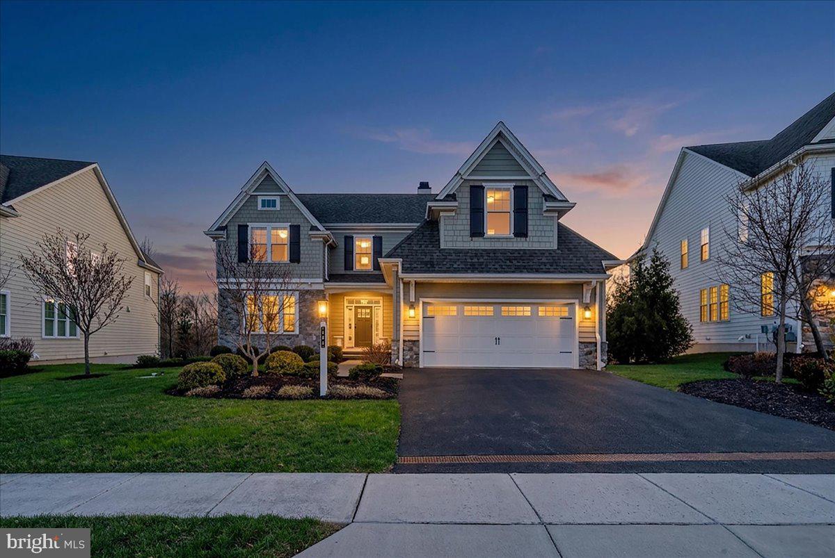 Proudly presenting this highly upgraded and sophisticated home in the award-winning community of Chapel Hill. Perfectly positioned on a premium lot backing to lush greenery and just steps from a scenic walking and biking trail, this residence offers a peaceful, turnkey lifestyle; simply unpack and enjoy.
Rich, dark hardwood floors greet you as you enter the home, complemented by an abundance of windows which fill the space with natural light. Just off of the foyer, a warm and inviting library features a cozy fireplace with white marble surround and custom built in shelving  on either side; perfect for quiet moments or a refined home office.
The heart of the home is the stunning open-concept gourmet kitchen and family room. Designed for both everyday living and entertaining, this space showcases a coffered ceiling with wood beams, a fireplace, and custom built-ins. The kitchen is beautifully appointed with a large center island with seating, pendant lighting, and a bright breakfast nook. There is a  luxurious primary suite on the main floor and it is a true retreat, featuring two spacious walk-in closets and a separate dressing room. The spa-like en-suite bath offers a soaking tub, dual vanities, and an elegant, serene atmosphere. Just beyond, a lovely sunroom with wood stove, provides the perfect transition to the outdoor deck, creating seamless indoor-outdoor living. A convenient first-floor laundry room adds to the home’s thoughtful design.
The second floor features another primary suite; two additional bedrooms and a jack and jill bath, providing comfort and privacy for family or guests.
The expansive lower level is an entertainer’s dream, offering a kitchenette, two generous living areas, a second office, a dedicated workout room, and ample storage space, ideal for today’s flexible lifestyle needs.
Out back, enjoy ultimate privacy with mature greenery and tranquil views of the Abbey, along with access to a one-mile walking and biking trail.
From the moment you walk through the front door, you’ll feel right at home; just drop your bags and start enjoying everything this exceptional property has to offer.