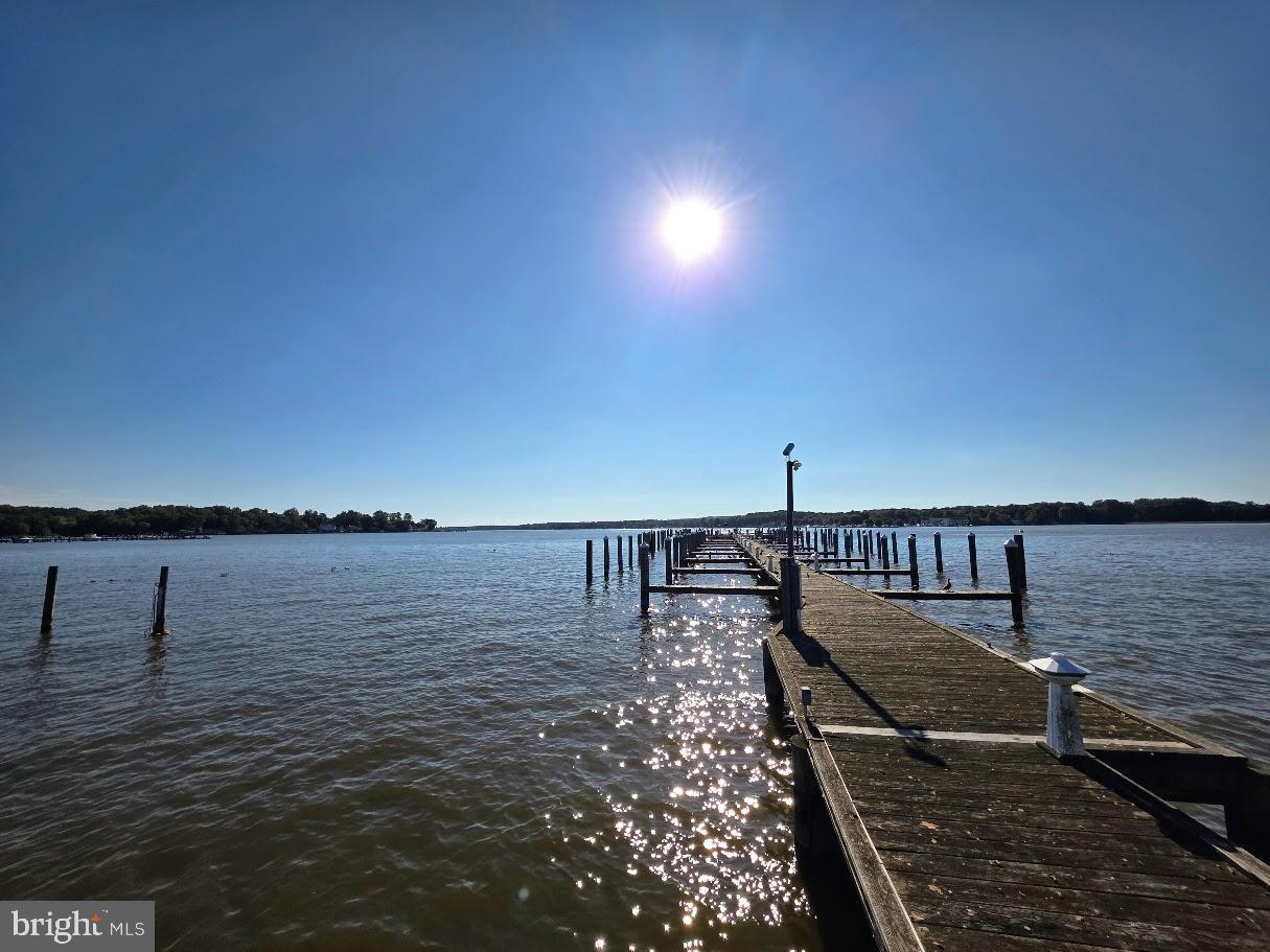 Great New Price! Located in the popular Water Front Community of Locust Point. This 4 Bedroom, 2 1/2 Bath Home has many Amenities & Updates. The Kitchen has upgraded tile Backsplash & Counter Tops with Butcher Block & Granite finish. The large Living Room has a wood Insert in the Fireplace. Also on this Level is a Bedroom . Upstairs are 3 nice size Bedrooms including the Laundry Room. The Primary Bedroom has good size & offers a recently upgraded Private Bathroom. The Lower Level offers a nice Entrance & 2 additional Living Spaces, including the Rec Room & Front Hobby Room. Throughout the Front of the House there are some Views of the Elk River & they only get better with the change of Season. The Garage runs the full length of the House, enabling enough Room for 2 Vehicles.  Outside there is plenty of options to Entertain with a Front Porch, Rear Deck with Awning & Patio. Also included with your Purchase is the Shed, Expanded Driveway, Ring System & built-in Garage Car Charger.  The Property has Deeded Water Rights with a Boat Ramp & Public Marina in the Neighborhood for River & Slip Access. This Home has been truly taken care of & will impressive even the pickiest of Buyer.