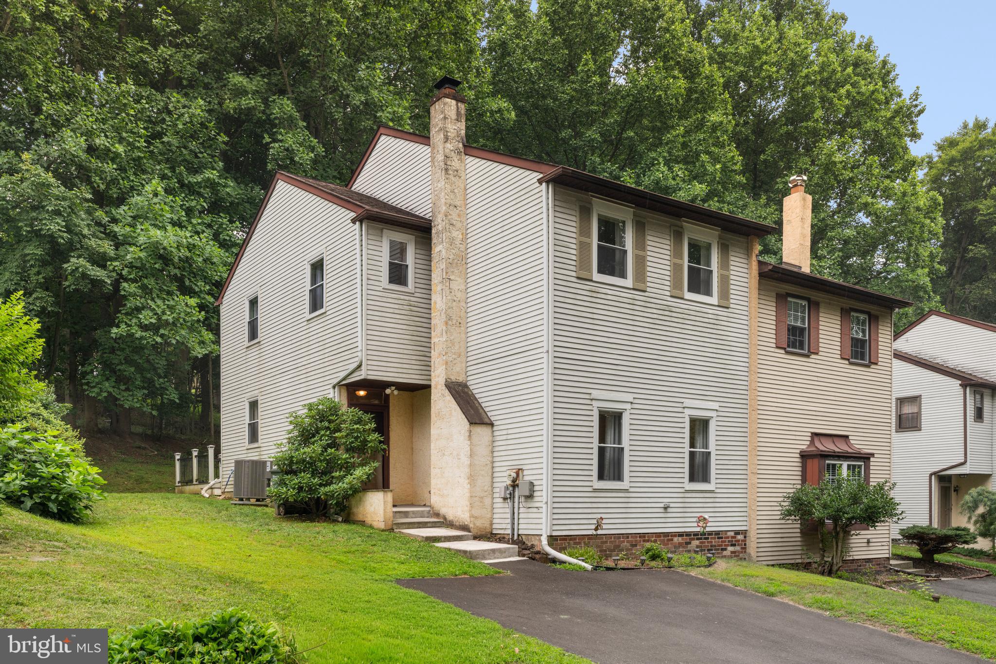 Escape the hustle and embrace peaceful living in this beautifully maintained 4-bedroom and 2.5-bathroom located in the highly sought-after Woodlyn Crossing community within the desirable Neshaminy School District! Nestled in a calm, tree-lined neighborhood, this gem offers the perfect blend of comfort, style, and privacy. With green scenery and a backyard, and a private deck overlooking mature trees, you'll surely enjoy a calm retreat. Enjoy the benefits of a well-maintained community with low HOA fees of only $360 quarterly, which include access to fantastic amenities such as a community pool, tennis court, and more. This home is also close to schools and parks. Parking is effortless with a private driveway accommodating two vehicles, along with plenty of available on-street parking for guests. Step inside to a welcoming foyer featuring a convenient coat closet before entering the impressive living room, where high ceilings and a cozy fireplace create a warm yet elegant atmosphere that's perfect for relaxing or entertaining. A powder room is thoughtfully located just off the main living area for guests.The heart of the home is the stunning kitchen, beautifully appointed with stainless steel appliances, sleek quartz countertops, a spacious center island, rich espresso shaker cabinetry, a stylish tiled backsplash, and a garbage disposal. Whether you're preparing meals or gathering with family and friends, this space is designed to impress. The kitchen also provides direct access to the private deck—ideal for outdoor dining, morning coffee, or simply enjoying the wooded surroundings. Adjacent to the kitchen is the bright dining area, creating a seamless flow for everyday living. Gorgeous hardwood flooring extends throughout the entire home, adding a timeless appeal. Upstairs, you'll find a spacious primary suite featuring two closets and a private en-suite bathroom, providing the perfect personal retreat. Three additional generously sized bedrooms offer flexibility for family, guests, or a home office. The laundry area is conveniently located in the fourth bedroom, and the upper level also provides access to the attic, offering abundant additional storage space. Outside, the property continues to impress with a private side and backyard, a separate storage area behind the home, and a tranquil backdrop of green mature trees that enhances both privacy and relaxation. This exceptional home combines thoughtful design, quality finishes, and a peaceful natural setting—making it the perfect place to call home. Schedule your showing today!
