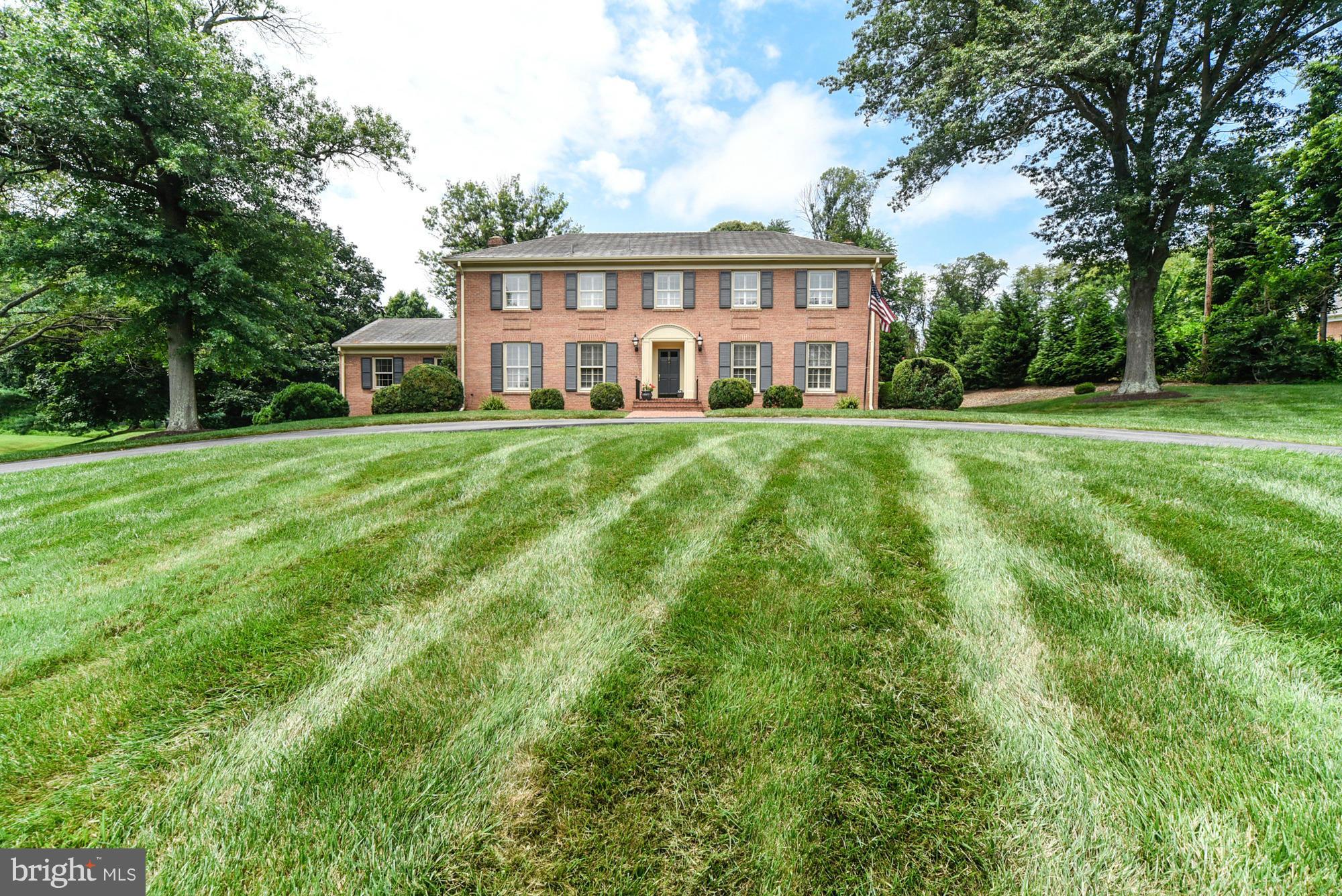 If you're looking for a pool and tennis court in an idyllic setting, you've come to the right place! Located on two beautiful rolling acres, the house is situated atop a knoll with a sweeping circular driveway.  Custom built by the present owners, the home features all brick construction, a circular driveway, a side entry two car garage with additional parking pad and a "user friendly" floor plan.