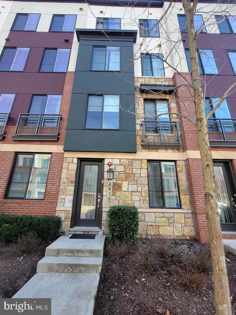Welcome to 4919 Trail Vista Ln. in the highly sought after Preserve at Westfields in Chantilly, VA! This gorgeous Craftmark Homes Westfield model has been meticulously maintained. A 4 level contemporary townhome w/ 1 car garage, 3 spacious bedrooms, 3.5 modern baths and proudly boasts 9 ft ceilings on all 4 levels. <br> <br>

This home has the perfect blend of comfort and luxury with countless upgrades! Lower level has a rec room with hardwood floors and access to the garage with its own EV charger. The spacious gourmet kitchen is a chef's dream with all the upgrades; stainless steel appliances, quartz countertops, center island and 5 burner gas cooktop with hood! The main level is complete with separate family & dining rooms and a half bathroom.<br> <br>

Venture upstairs where you will find 2 great primary owners suites, each with their own private bathrooms. Perfect for housing guests, a home office, a workout room, etc.. Finishing this level is a laundry closet with a new stackable washer and dryer. <br> <br>

Enjoy entertaining guests and family on the upper level which features a loft with hardwood flooring, a 3 bedroom, full bathroom and a breathtaking rooftop terrace with panoramic views of the surrounding neighborhood! <br> <br>

This property is surrounded by every suburban advantage with moments to trails, parks, and only one block to Wegmans, shops, restaurants and entertainment. Hop on Route 28 for convenient commutes for work and play. Immediate access to Dulles Airport, Ii66, and Rt.50. Centrally located to Dulles Tech Corridor. Making the convenience and accessibility of the neighborhood nearly unmatched. Don't miss out on the opportunity to make this beautiful home yours and enjoy all the benefits that the Chantilly community has to offer!