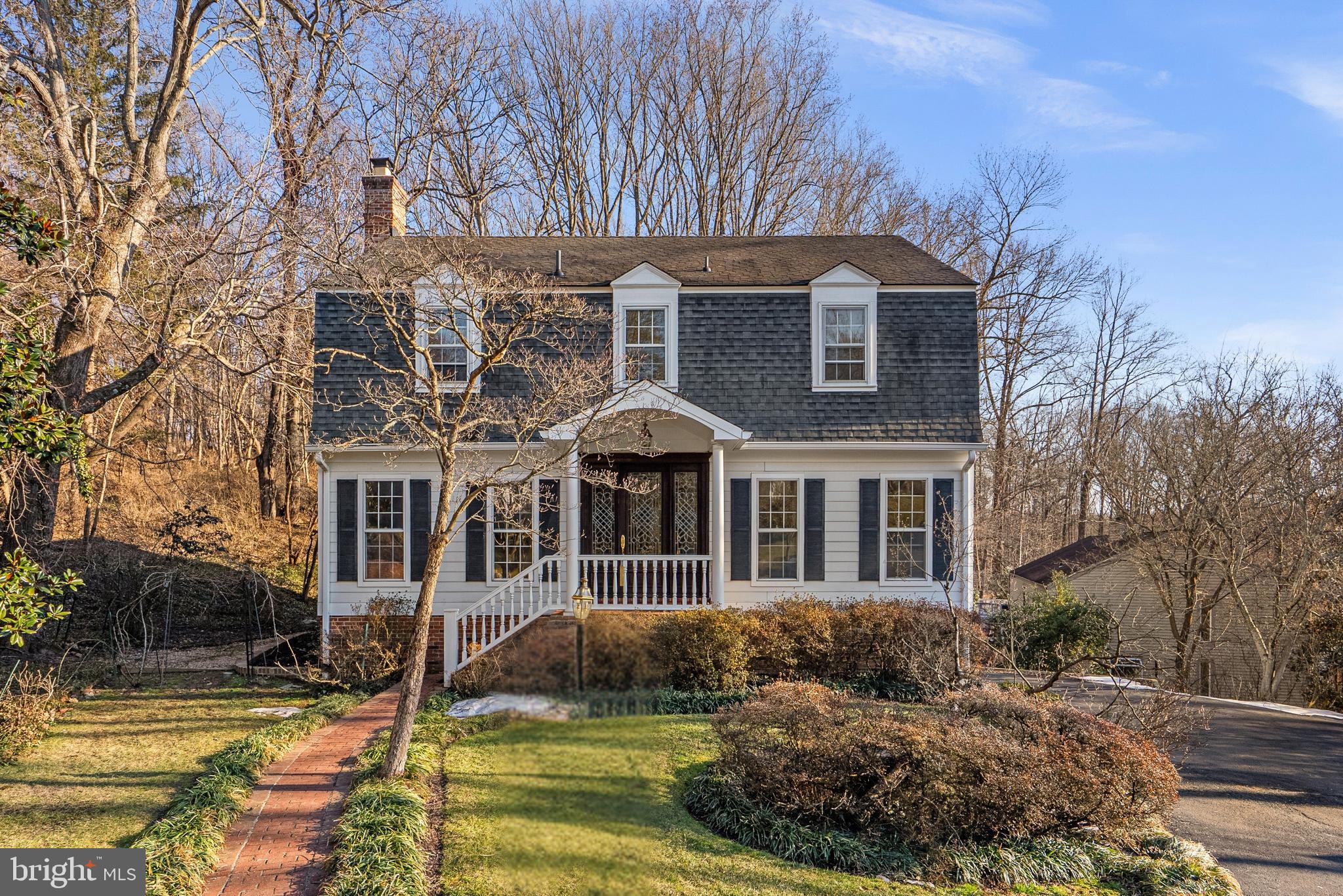 Nestled on a quiet cul-de-sac in the highly sought-after The Dogwoods at Langley, this charming center hall Colonial offers timeless elegance, thoughtful updates & exceptional privacy.

From the moment you arrive, the lovely curb appeal, uniquely beautiful front door & manicured landscaping set the tone. Inside, sun-filled formal living & dining rooms showcase detailed molding, beautiful hardwood floors, custom built-ins & three functioning fireplaces that add warmth and character throughout the home.

The inviting family room features a cozy fireplace, built-ins & a wet bar, opening to a spacious deck overlooking the backyard ideal for entertaining, relaxing or play. Backing to Fort Marcy, the setting feels wonderfully private. The tastefully renovated kitchen offers stainless steel appliances, abundant cabinetry & a dedicated desk or office nook with a bay window overlooking the backyard, perfectly suited for everyday living. A two-car garage & irrigation system add ease and convenience.

Upstairs, the spacious primary suite is a true retreat with dual walk-in closets & dual vanities. The finished walk-out lower level provides exceptional flexibility, featuring a fireplace, two additional bedrooms & a full bath perfect for guests, multi-generational living or a private workspace.

Residents enjoy access to two neighborhood tennis courts within a community where opportunities are rare because neighbors love to stay. Ideally located just minutes to downtown McLean, Tysons, Washington, D.C., Reagan National Airport, GW Parkway & I-495. Enjoy nearby Turkey Run Park & Scotts Run Park, offering scenic trails to the Potomac River, Chain Bridge & the C&O Canal.

This home offers a rare combination of privacy, space, charm & location in one of McLean’s most desirable neighborhoods served by award winning schools.

Wood rot was observed during replacement of the sliding glass doors in the family room. The property is being sold strictly AS-IS. Purchaser acknowledges and agrees that seller will make no repairs and that purchaser shall accept the property in its present condition.