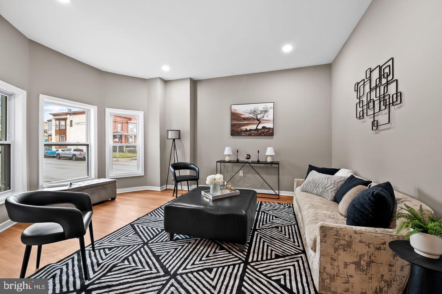 BACK ON THE MARKET after the previous buyer caught cold feet — appraisal already completed, offering added confidence for the next owner.

Introducing 2401 Harlem Avenue — an end-of-group masterpiece nestled in the prestigious Evergreen Lawn neighborhood. As one of the largest homes in the neighborhood, this expansive 6-bedroom, 3.5-bathroom residence seamlessly blends historic charm with modern luxury while offering an exceptional amount of living space.

Step inside to discover a bright and elegant interior featuring brand-new hardwood flooring and luxury vinyl plank, fresh contemporary paint, recessed lighting, and abundant natural light throughout. The main level offers a rare and highly desirable layout featuring a spacious primary suite complete with a sitting room, walk-in closet, full bath, and additional half bath — ideal for multigenerational living or added convenience.

The gourmet kitchen showcases upgraded countertops, all-new cabinetry, stainless steel appliances including a gas range and microwave, and a spacious dining area perfect for entertaining.

Upstairs, you’ll find four generously sized bedrooms designed for comfort and privacy. The fully finished lower level provides even more versatile living space with a recreation room, additional bedroom, full bath, laundry area, and private exterior entrance — ideal for an in-law suite, guest quarters, rental potential, home gym, or media room. This level also offers direct access to the oversized two-car garage.

Outside, the timeless brick exterior is complemented by a private walled front patio, additional street parking, and a landscaped yard. Sidewalk-lined streets, street lighting, and the historic character of Evergreen Lawn further enhance the neighborhood’s charm.

Conveniently located minutes from Downtown Baltimore and close to public transportation, this move-in-ready home offers luxury, space, and endless possibilities for homeowners and investors alike — including potential assisted living or income-producing opportunities.

✨ Buyer Incentives Available:
• $10,000 Mortgage Grant Down Payment Program
• $5,000 Closing Cost Assistance Program
• $10,000 CDBG Program
• MMP and additional buyer programs may apply

Additional highlights include:
• Lead certificate on file
• Use & Occupancy Permit on file
• Transferable home warranty (to be confirmed)

Property is not currently staged.

Experience the perfect balance of historic architecture, modern elegance, and unmatched space — welcome home to 2401 Harlem Avenue.