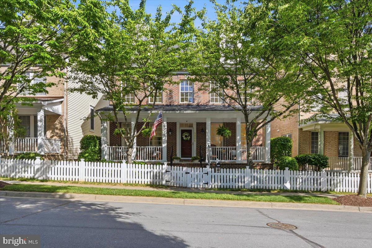 Welcome home to this stunning King Farm Irvington Center gem in Rockville! This beautifully maintained brick-front home offers 3 finished levels plus a basement, blending elegance, comfort, and flexibility in one incredible package. From the charming white picket fence and welcoming front porch to the sun-filled interior, this home is full of warmth and personality.
Inside, you’ll find oversized windows, recessed lighting throughout, cozy spaces to gather, and a gas fireplace perfect for relaxing evenings at home. The spacious layout features 4 bedrooms, 3 full bathrooms, and 1 half bath with room for everyone to spread out and enjoy.
The dreamy primary suite feels like a private retreat with elegant French doors, two walk-in closets, and a bonus sitting area ideal for a home office, lounge space, or reading nook. Upstairs laundry adds everyday convenience, and the third level offers a fantastic private guest suite complete with a full bath, perfect for visitors, multigenerational living, or flexible workspace needs. Ceiling fans throughout the home keep the air flowing and the atmosphere comfortable year-round.
Thoughtful updates include Updates include: Roof (2021), Trex Deck Built (2024), Hot Water Heater (2023), HVAC and 1 AC Unit (2022) 2nd AC Unit (2020). 
And here’s the showstopper,  qualified buyers may have the rare opportunity to assume the existing VA loan at an incredible 2.38% interest rate! Seller must have VA Eligibility Restored. 
All of this in the highly sought-after King Farm Irvington Centre, just moments to shopping, dining, parks, Metro access, and everything Rockville has to offer. This home checks every box and then some!