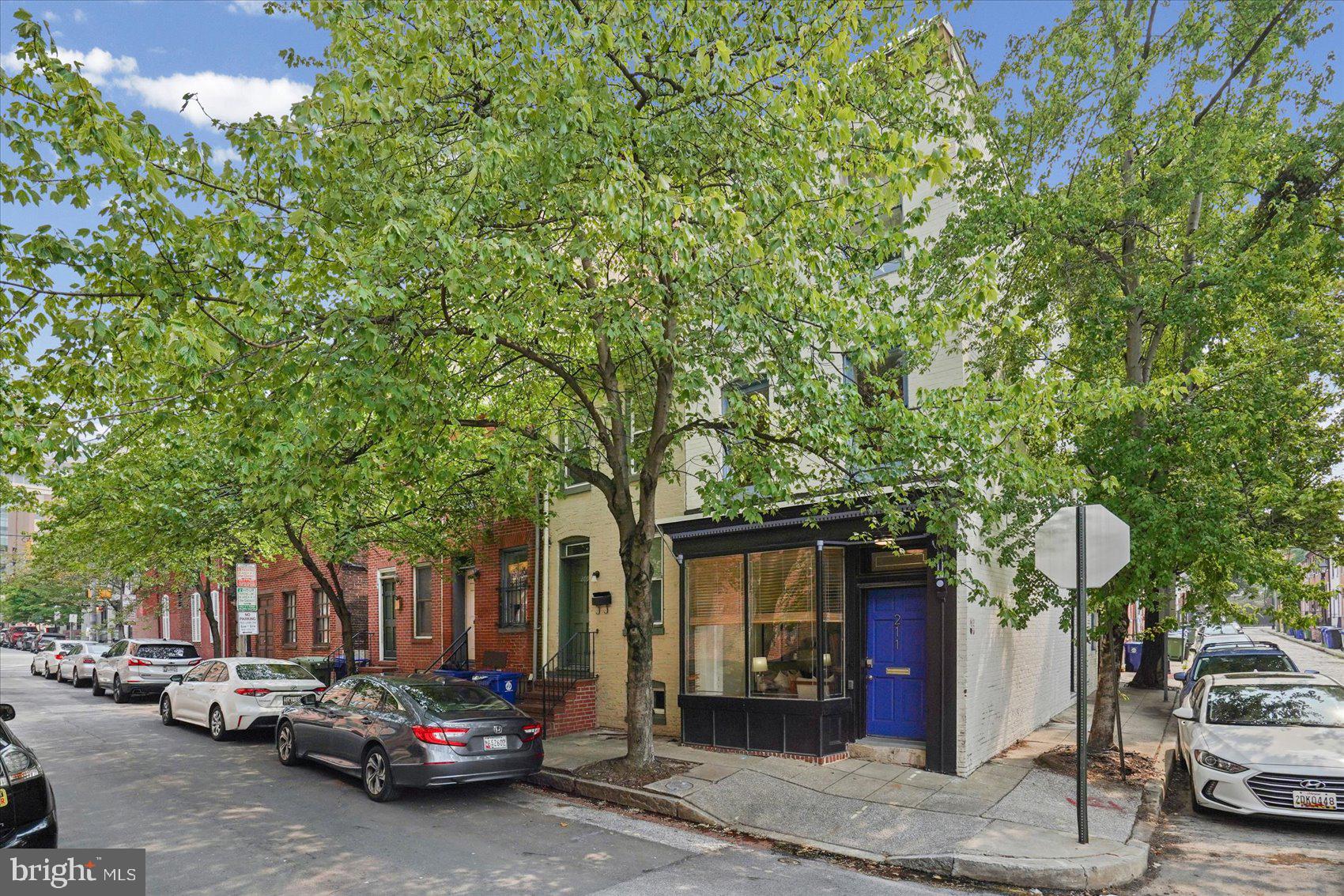 Welcome to 211 Penn Street, where timeless Baltimore character meets modern comfort in the heart of historic Ridgely's Delight. This spacious end-of-group rowhome offers generous living areas filled with natural light, soaring ceilings, exposed brick, and architectural details that reflect its rich history. The thoughtfully updated kitchen and baths blend seamlessly with the home's original charm, while the spacious bedrooms provide comfortable retreats. Step outside to the private rear deck; an ideal space for morning coffee, outdoor dining, or relaxing after a day in the city. Enjoy the convenience of being just moments from the University of Maryland Medical Center, Camden Yards, M&T Bank Stadium, MARC train service, I-95, and the vibrant restaurants, shops, and entertainment of Downtown Baltimore. Whether you're looking for a unique place to call home or a property with exceptional location and versatility, 211 Penn Street is a rare opportunity you won't want to miss.