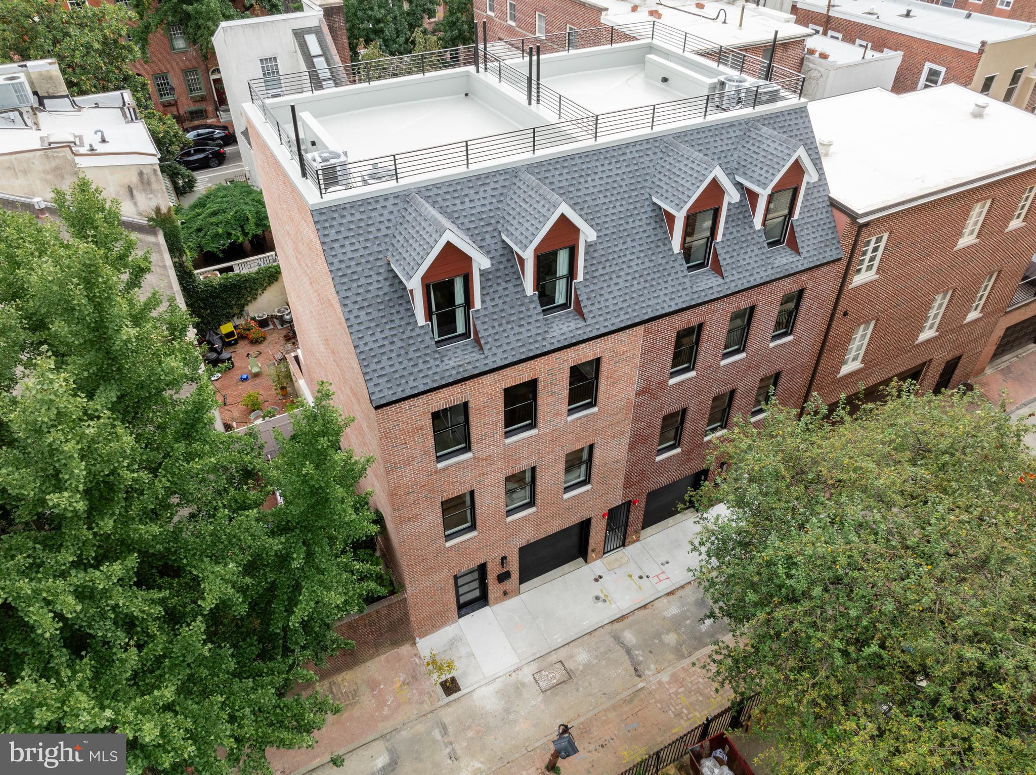Price improvement!  Welcome to 610 Panama Street, an extraordinarily rare find in desirable and Historical Society Hill, Philadelphia. This stunning new construction seamlessly blends modern amenities with timeless design, offering an unparalleled level of elegance and sophistication across its expansive 3,200+/- square feet. Every detail of this three-bedroom (fourth bedroom option), three-and-a-half-bath home, has been meticulously curated to create a luxurious sanctuary. Step inside to discover a spacious open floor plan, graced with custom wood floors and illuminated by the natural light streaming through double-hung custom Anderson windows. The soaring ceilings and thoughtful design provide a sense of grandeur and warmth. The state-of-the-art Chef’s Kitchen serves as the centerpiece of the main living area and is truly the heart of this home. Adorned with high-end Subzero and Wolf appliances, bespoke cabinetry from Porcelanosa, and sleek waterfall countertops, this kitchen is both a functional workspace and an exquisite focal point for entertaining. A wet bar and deep sink add to the kitchen’s convenience, making it perfect for hosting intimate gatherings or grand celebrations. Retreat to the expansive primary suite, a haven of tranquility featuring three custom closets and an abundance of natural light. The spa-like primary bath is a masterpiece of design, showcasing a glass-enclosed shower with intricate tilework, a double vanity, and a separate private restroom. Each additional bedroom is spacious and well-appointed, ensuring comfort and privacy for family and guests alike. The fully finished basement, with its impressive 8- and 9-foot split ceilings and full private bathroom, offers endless possibilities. Whether envisioned as an indoor entertainment space, a media room, or a fourth bedroom, this versatile area adapts to your lifestyle needs. The oversized one-car garage adds convenience and security, a coveted feature in this historic neighborhood. Experience the best of indoor-outdoor living with two distinct outdoor spaces. The serene backyard provides a private escape from city life, while the expansive rooftop deck offers breathtaking views of historic Society Hill. These spaces are ideal for dining al fresco, enjoying evening cocktails, or simply unwinding amidst the beautiful cityscape. Built with precision and care, this home features energy-efficient closed-cell spray foam insulation throughout, dual-zoned split air systems, and premium materials throughout. 610 Panama Street is more than just a home; it is a statement of refined living. This rare opportunity to own a new construction townhome in Society Hill offers the perfect blend of contemporary design, modern convenience, and timeless elegance. Living in Society Hill means you will be surrounded by some of Philadelphia’s finest restaurants, shops, and cultural landmarks, all while enjoying the tranquility of this tree-lined, historic neighborhood. Embrace the prestige of owning a residence that truly stands out, where history and luxury meet to create a living experience like no other.

***** Includes10-Year TAX ABATEMENT**********

 Taxes & Square footage is the responsibility of the buyer to have verified