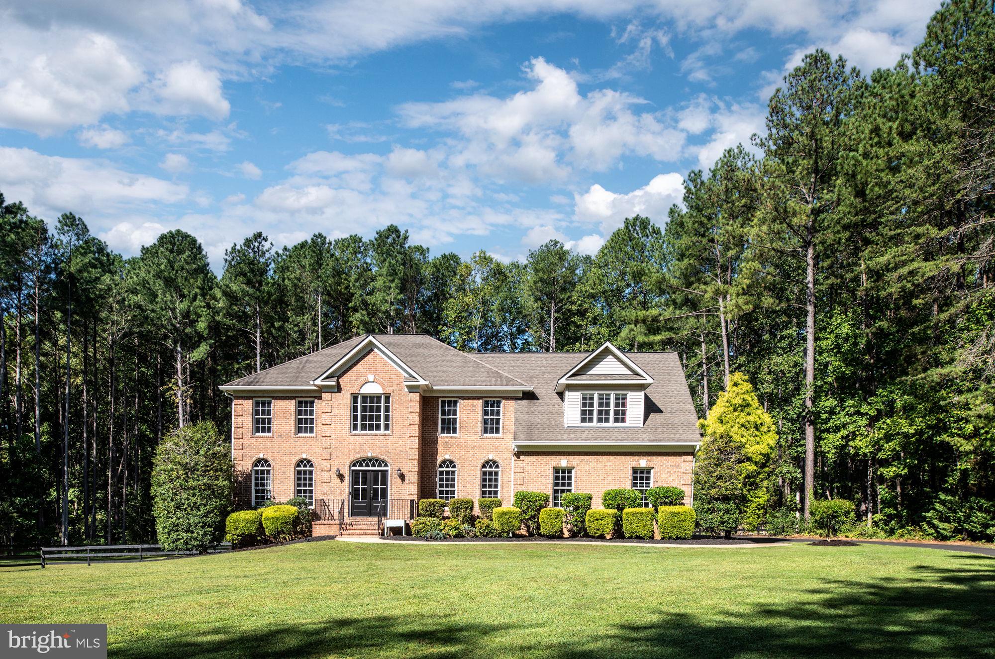 Welcome to your dream home! Nestled on a sprawling 4.51-acre lot, this stunning Colonial-style residence offers a perfect blend of comfort, elegance, and modern amenities. Built in 2000, this well-maintained property boasts 5320 square feet of finished living space, providing ample room for relaxation and entertainment. As you step inside, you are greeted by a warm and inviting atmosphere, enhanced by a two story foyer, beautiful hardwood floors and tasteful crown moldings throughout. The traditional floor plan features a formal dining room, perfect for hosting gatherings, and a cozy breakfast area that invites you to enjoy your morning coffee. The gourmet kitchen is a chef's delight, equipped with stainless steel appliances, upgraded countertops, and a spacious pantry, making meal preparation a joy. This home offers four generously sized bedrooms, including a luxurious primary suite complete with a walk-in closet and an en-suite bathroom featuring a soaking tub and a stall shower. Each bathroom is thoughtfully designed with modern fixtures, ensuring comfort and convenience for all. The fully finished basement adds even more living space, with daylight windows and a walkout entrance that leads to the beautifully landscaped yard. Imagine hosting summer barbecues on the expansive deck or enjoying quiet evenings on the porch, surrounded by the serene beauty of nature. The property backs to trees, providing a private oasis where you can unwind and appreciate the picturesque views of the garden and woods. For those who love to entertain, the outdoor space is a true highlight, featuring an in-ground pool that promises endless summer fun. The extensive hardscape and well-maintained landscaping create an inviting atmosphere for outdoor gatherings or peaceful retreats. Additional features include an oversized attached garage with an installed electric vehical charger and oversized space for three vehicles, ensuring convenience and ample storage.  Located in a tranquil, horse friendly, neighborhood with no thru streets, this home offers a perfect balance of privacy and community. With amenities such as common area maintenance and snow removal included in the association fee, you can enjoy a low-maintenance lifestyle. Don’t miss the opportunity to make this exceptional property your own. Schedule a tour today and experience the warmth and charm of this beautiful home!