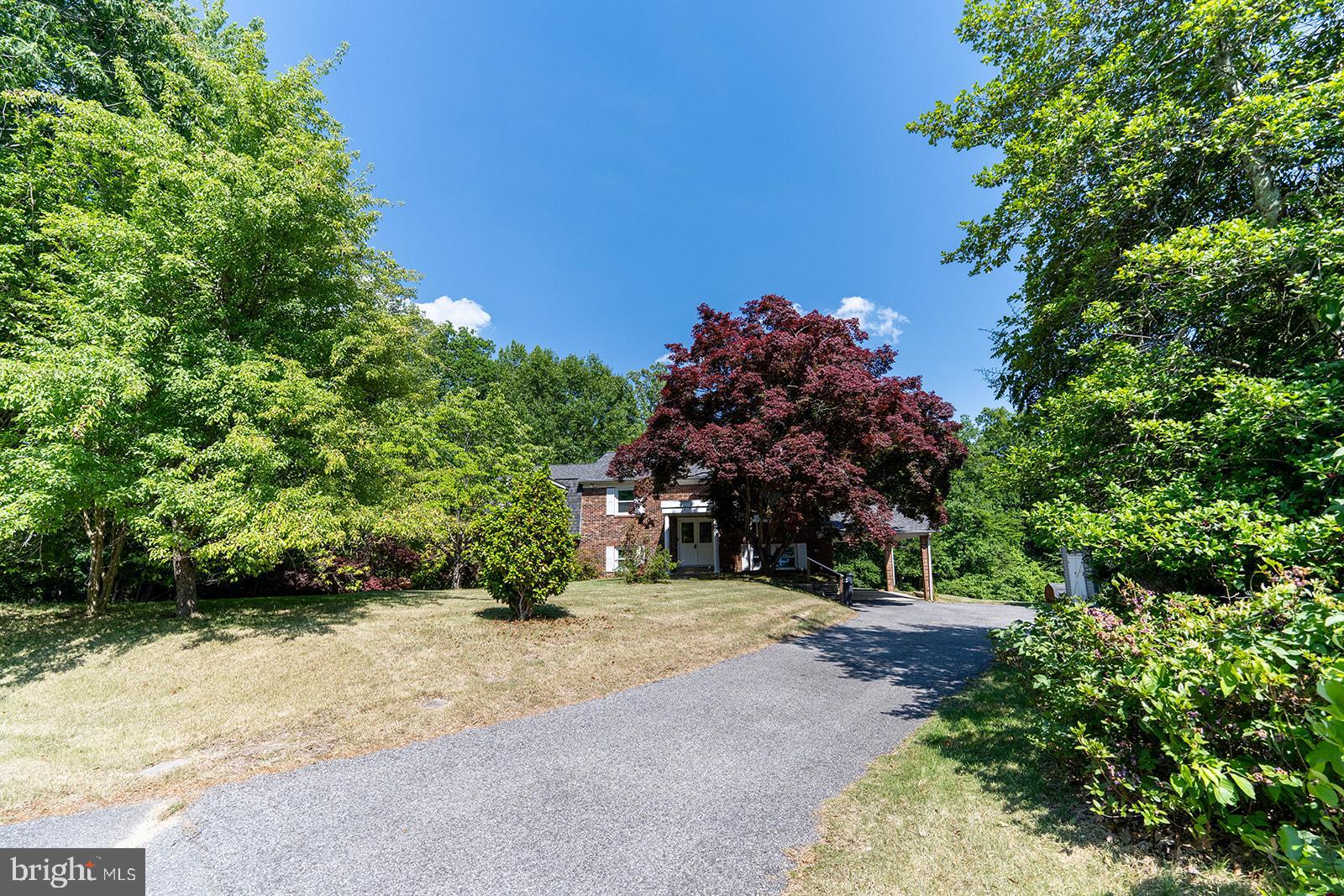 NEED IN-LAW SPACE?  - This one has it!  WOW!!  Great House!  WAITING FOR YOU!!  Possible In-law or rental possibility!!  Space is what you get!  5 BEDROOMS, 3 FULL BATHS,  TOTAL.  ALL on a 2.4 Acre Lot at the end of the Cul-De-Sac!!   2nd KITCHEN on Lower Level with 2 Bedrooms, Full Bath, Family Room, New Carpet, Patio, Separate Entrance  which gives the opportunity for an apartment type scenario if needed.  UPPER/MAIN Level offers 3 Bedrooms, 2 Full Baths, Hardwood Floors, Updated Kitchen with SS Appliances, granite Counters, Double Wall Ovens, Counter/Bar and separate dining area with bay window, Living room, Access to Large Deck overlooking a large private back yard from Kitchen and Primary Bedroom.   Washer and Dryer on both levels.  Fireplace in Family room in lower level.  Updated Windows, Updated Roof (2024), Brick Front, Carport, private back yard, 2 Sheds, Large Deck, Garden area, and the list goes on.  This property offers so much..Don't miss out on this one.