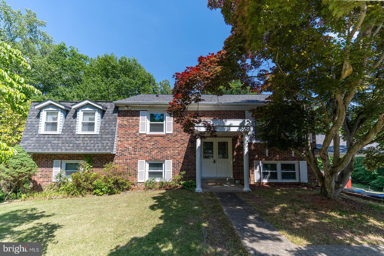 WOW!!  Great House!  Space is what you get with this one!  5 BEDROOMS, 3 FULL BATHS,  TOTAL.  ALL on a 2.4 Acre Lot at the end of the Cul-De-Sac!!   2nd KITCHEN on Lower Level with 2 Bedrooms, Full Bath, Family Room, New Carpet, Patio, Separate Entrance  which gives the opportunity for an apartment type scenario if needed.  UPPER/MAIN Level offers 3 Bedrooms, 2 Full Baths, Hardwood Floors, Updated Kitchen with SS Appliances, granite Counters, Double Wall Ovens, Counter/Bar and separate dining area with bay window, Living room, Access to Large Deck overlooking a large private back yard from Kitchen and Primary Bedroom.   Washer and Dryer on both levels.  Fireplace in Family room in lower level.  Updated Windows, Updated Roof (2024), Brick Front, Carport, private back yard, 2 Sheds, Large Deck, Garden area, and the list goes on.  This property offers so much..Don't miss out on this one.