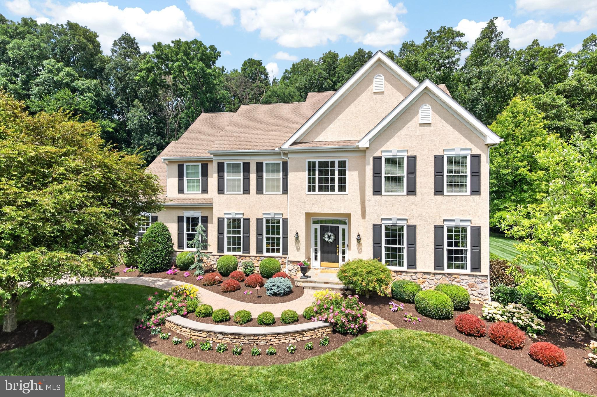 Welcome to this exceptional semi-custom home, proudly offered by its original owners and meticulously maintained inside and out. Nestled on a premium lot backing to 170 acres of preserved open space, this property offers the perfect combination of privacy, quality craftsmanship, and everyday convenience.

Step inside to find beautiful hardwood flooring and a thoughtfully designed floor plan ideal for both everyday living and entertaining. The spacious kitchen features stainless steel appliances, a large center island, abundant cabinetry, and flows seamlessly into the breathtaking family room. This impressive space showcases a soaring vaulted ceiling open to the second floor and is anchored by a stunning floor-to-ceiling stone gas fireplace, creating a warm and inviting focal point for gatherings. A private first-floor office provides the perfect work-from-home space, while the mudroom off the garage includes convenient rear staircase access to the second floor.

The spacious owner's suite is a true retreat, complete with a tray ceiling, two walk-in closets, and a luxurious en suite bath featuring a double vanity, soaking tub, and oversized walk-in shower. Three additional generously sized bedrooms offer plenty of space for family, guests, or hobbies.

The unfinished walkout basement presents endless possibilities with 9-foot ceilings, rough-in plumbing for a future full bath, and ample room to expand your living space.

Outside is where this home truly shines. The professionally designed backyard is a private oasis featuring stunning hardscaping and an incredible outdoor kitchen area complete with a propane line for a grill, dedicated space for a mini refrigerator, and multiple areas for relaxing and entertaining while enjoying peaceful views of the preserved open space beyond.

Conveniently located just minutes from the Route 30 Bypass, shopping, dining, parks, and recreation, this remarkable home offers the ideal blend of luxury, comfort, and accessibility. A rare opportunity to own a beautifully cared-for home in an exceptional setting.