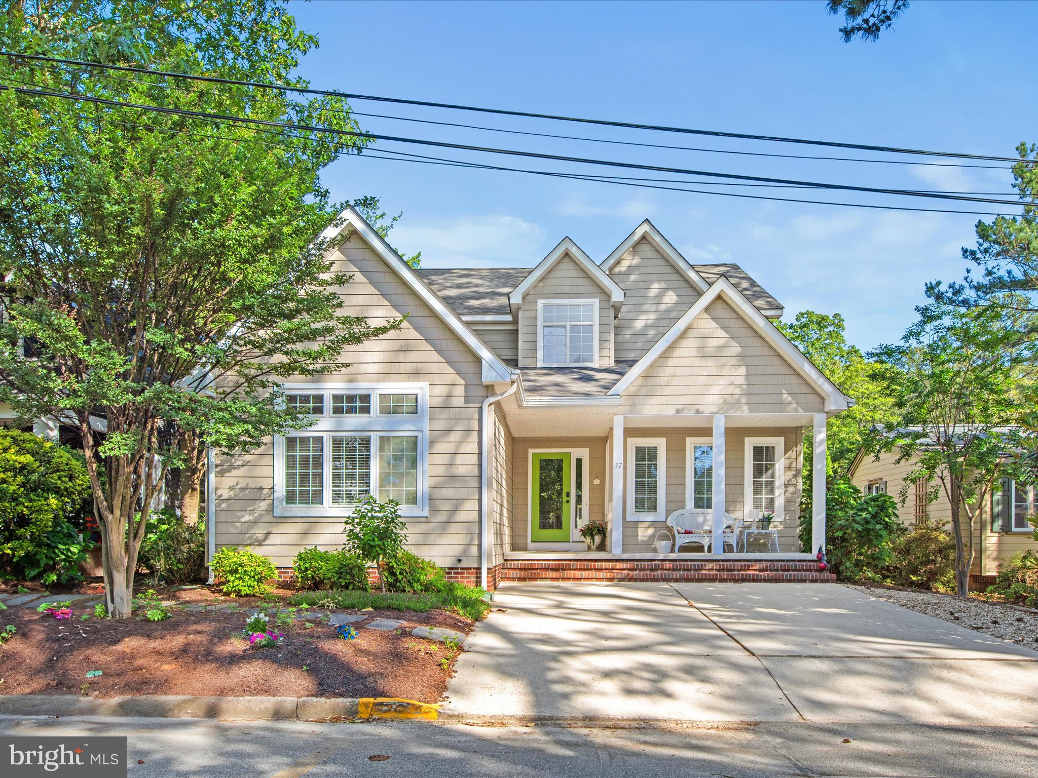 Welcome to this beautifully maintained coastal home, ideally located just three blocks from the ocean in a quiet and private neighborhood. Built in 2001, this 4-bedroom, 3.5-bath residence also includes a flexible den/office that can easily serve as a fifth bedroom—perfect for guests. Proudly owned by the original owner and never rented, the home features a bright, open living area with a lofted ceiling and gas fireplace, a generous dining room, and a spacious kitchen with ample storage and functionality. Step outside to a fully fenced backyard with a large flagstone patio—ideal for outdoor entertaining or quiet relaxation. Additional highlights include a laundry/mudroom with a separate entrance and convenient access to the outdoor shower. Whether you're seeking a full-time residence or a relaxing beach retreat, this home offers the best of coastal living just minutes from the boardwalk, shops, restaurants, and more.