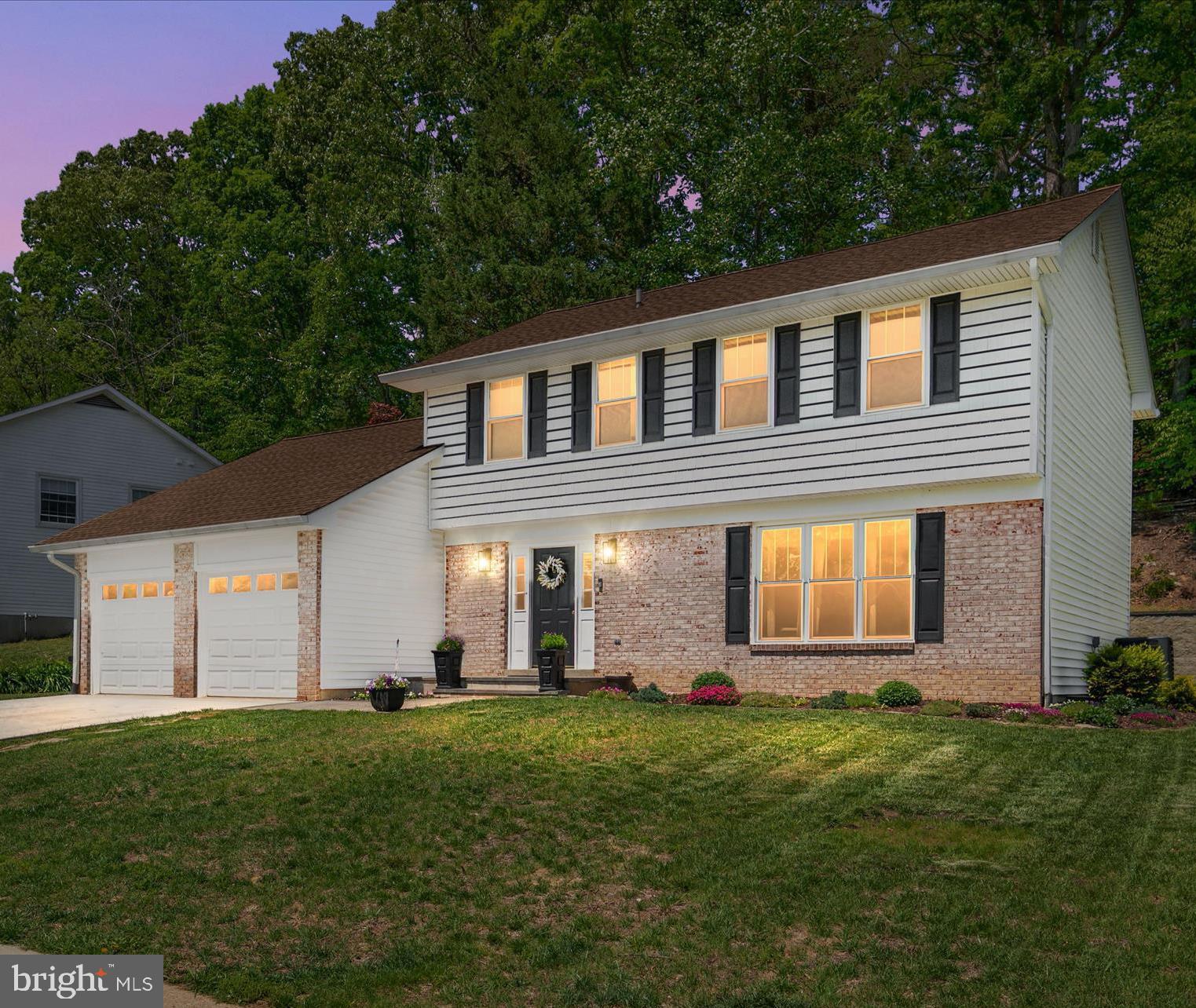 Welcome to 397 Westbury Drive, an impeccably updated 4-bedroom, 2.5-bath colonial in the highly sought-after, water-privileged community of Annapolis Landing. Showcasing an extensive list of meticulous recent home improvements, this property is a true turnkey standout.
Step inside to a beautifully remodeled open-concept main floor featuring top-quality luxury vinyl plank flooring, upgraded wood baseboards, and custom window and door trim. The gourmet kitchen is an entertainer’s dream, boasting custom solid maple cabinets, quartz countertops with a custom backsplash, and a stunning Amish-made center island with a granite top. It comes fully equipped with a stainless steel farm sink, custom undermount lighting, and high-end GE Profile appliances, including an upgraded gas range.
The kitchen flows effortlessly into the living and dining spaces, leading out through a new sliding glass door to a fantastic backyard oasis. Here, you can relax on the custom deck featuring composite decking and built-in seating, or gather around the nearby fire pit on the lush, manicured lawn.
Upstairs, you will find three generously sized bedrooms alongside fully remodeled primary and second-floor bathrooms. The fully finished basement adds incredible flexibility, showcasing a custom shiplap wall feature and beautiful luxury vinyl plank flooring throughout a sprawling recreation room. This lower level also boasts a dedicated bedroom currently used as a home gym and a massive laundry room outfitted with extensive shelving, a stainless-steel utility sink, and a new washer and dryer.
Major big-ticket exterior and mechanical updates have already been handled for you, giving you total peace of mind. The welcoming front facade features charming brick accents and a newly widened concrete driveway leading to a two-car garage with new LiftMaster electric openers. Additional upgrades include new house siding, new windows throughout, and extensive landscaping with front and backyard grading.
Beyond the home itself, aerial views highlight Annapolis Landing as a picturesque, heavily wooded neighborhood with quiet, tree-lined streets. Located on Beard’s Creek just off the South River, this active community features a private waterfront park, a marina with 62 boat slips, a transient pier, a boat ramp, and racks for dinghies, kayaks, and canoes. Neighbors frequently gather for beloved community events like the annual Spring Sock Burning, summer raft-ups, and "Docktails" happy hours.
With pristine upgrades, beautiful outdoor living spaces, and convenient commuter access to Annapolis, Baltimore, and Washington, D.C., 397 Westbury Drive isn't just a house—it's the lifestyle you've been waiting for!