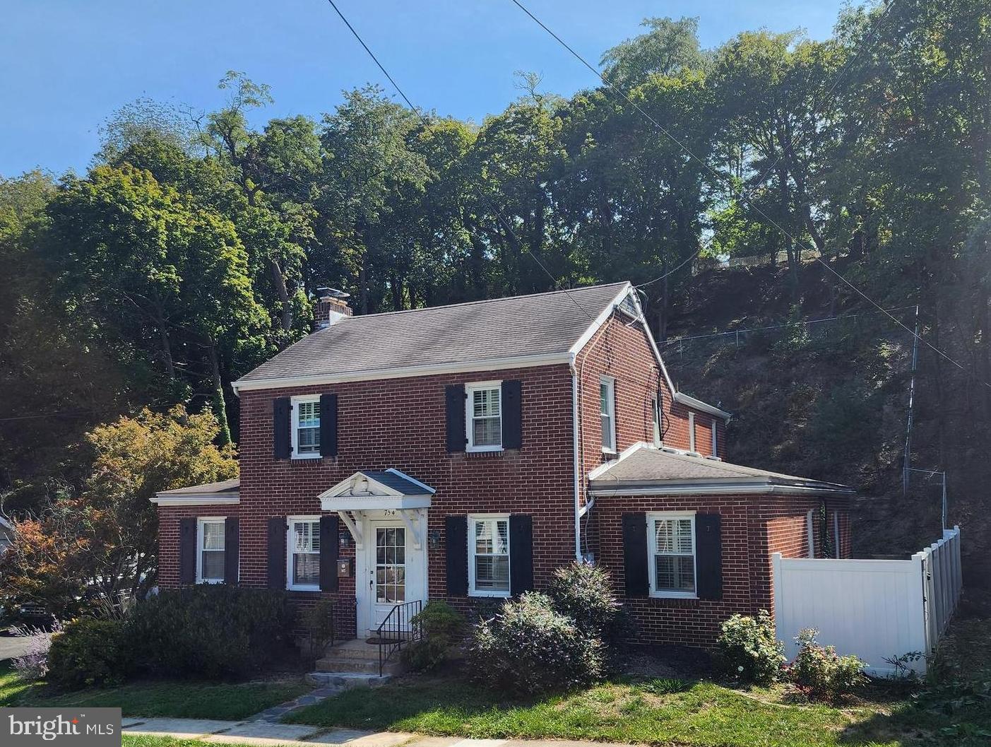This charming all-brick home is located in the historic Cumberland West Side of Mountain Side, Maryland. With 4 bedrooms and 2 bathrooms, it offers a perfect blend of classic charm and modern convenience. The large eat-in kitchen, while the formal dining room adds an elegant touch. The main level features a versatile bedroom that could also serve as a home office, the upper level includes 3 bedrooms and 2 bathrooms, including a spacious owner’s suite with a walk-in closet and private bath. Comfort is assured with gas forced air heating and central A/C. The property also boasts an oversized driveway, a carport, and a fully fenced rear yard, perfect for outdoor activities. Enjoy the outdoors from the screened-in porch, making this home a true gem in a walkable neighborhood.  Price to sell and below appraised value.  Schedule your tour today!