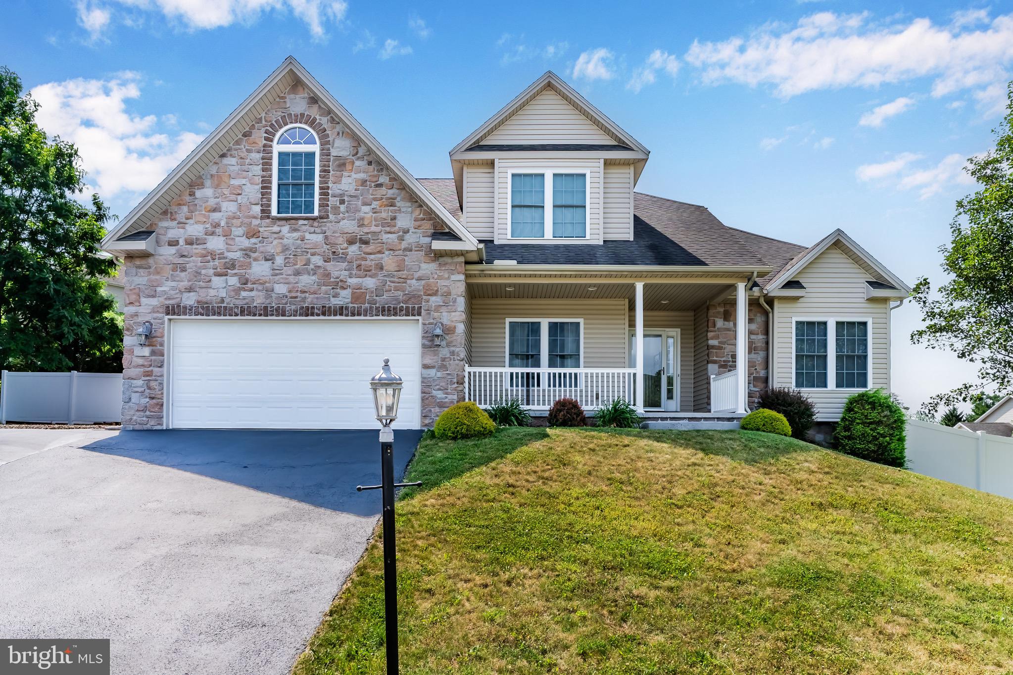 Why is the Suburban Dillsburg Area becoming so Popular?  Come and See for yourself -  You'll be Glad You Did!   This "Better Than New" Home in the Attractive Mountain Crest Community is Beautiful Throughout and Ready for You to Move In and Enjoy!   The "Ooh and Aahh" Highlights include the Spacious, Dramatic Multi-Level Great Room, Awash with Natural Light and Flowing into the Large Gourmet Kitchen, as well as a Ground Floor Master Suite - a Rare and Exciting Find - with Full Bath and Large Walk-in Closet.    The Home's Basic Features are 5 Bedrooms, 2.5 Baths, 2 Car Garage, Partially Finished Walkout Basement, 6' Vinyl Privacy Fence in the Backyard, with a Wide Ground Floor Trex Deck and Fire Pit!   The Home sits up High, with a Steep Driveway that offers a Dramatic Mountain Range View.  See this Home Today!