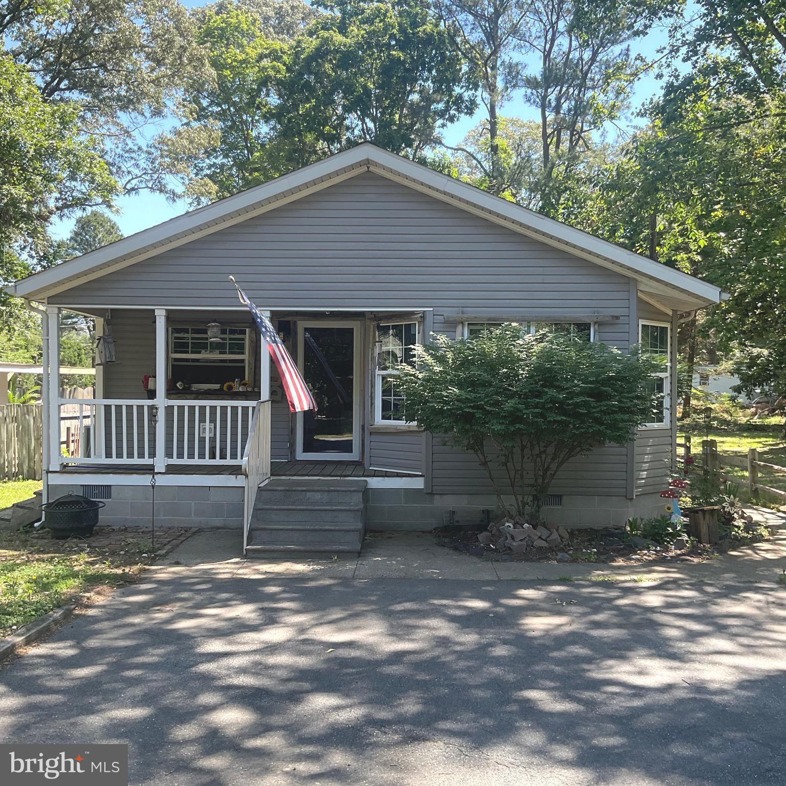 Are you looking for an affordable home near the Delaware beaches with no lot rent, no homeowner's association or deed restrictions.? This is it! Situated in Lewes, DE, close to beaches, dining, shopping, and coastal recreation.  This property is great option for a primary residence, second home, or vacation home.
The private rear yard is fenced and has a shed.  Home being sold " As Is "