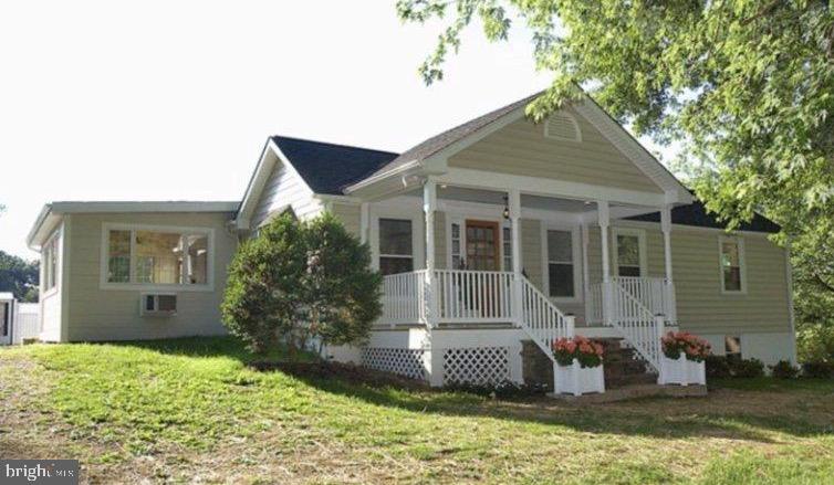 *FURNISHED ONLY* Available Feb 15, 2024NOTE- Hi-SPEED INTERNET from High Mountain Internet. 149 mo. Extra!  On Well & Septic,  MONTHLY PEST CONTROL & Stink Bug Spraying 1 x year-(Non negotiable). Tenant Must pay monthly pest management to LaMarr $55/mo. 
2 Bedrooms with medium size closets & dressers. Sunny back deck w/views to Bull Run Mountain. One level living, quiet setting, set back off Rd. Hardwood floors, except on Enclosed Sun Porch; Travertine. (currently furnished as Formal Dining Room), Tile Floor.
Also serves as a large work from home Office/Conference Room. Tray ceilings in main rooms. Deep open front lawn. Tall Row of flowering Viburnum Bushes offer extra Privacy from road. Parking in back parking area only. Mud room w/washer dryer & pull down Ironing Board & Iron in hidden cabinet. Length Of Stay Negotiable. IF a pet is allowed, Tenant must have premises de-flee & de-ticked at end of Term & pay a pet damage deposit, dependent on type & size of Pet, and determined by prior rental references. NO PUPPIES CONSIDERED. Case by case on pets.