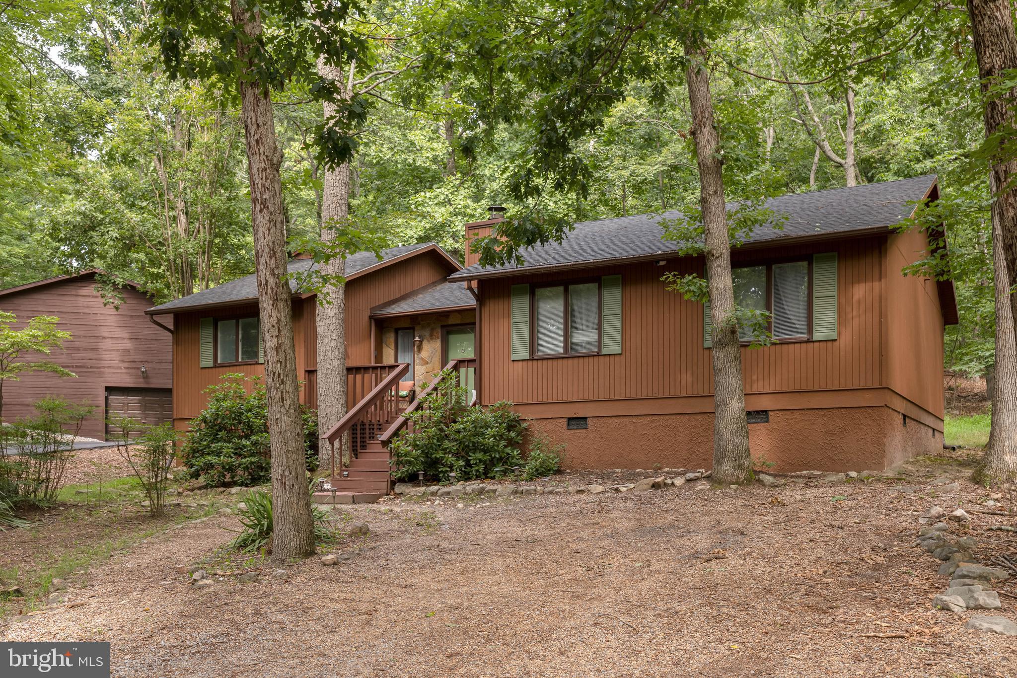 Welcome to your turnkey mountain retreat in Massanutten! This beautifully updated 4-bedroom, 2-bath home sits on a private, wooded 0.25-acre lot just minutes from the ski slopes. Featuring a warm and inviting interior with a floor-to-ceiling stone fireplace, comfortable living spaces, and a spacious screened porch overlooking the peaceful wooded surroundings, this home is the perfect place to relax and enjoy all that the mountains have to offer.

The home offers four bedrooms, two full bathrooms, and a layout designed for easy mountain living. Recent updates include a new roof (2021) and new water heater (2025). Sold fully furnished, this property is truly move-in ready and ready to enjoy immediately as a vacation home, investment property, or full-time residence.

Located in the sought-after Massanutten community, residents and guests enjoy access to skiing, golf, hiking, mountain biking, the indoor waterpark, dining, and year-round recreation. With short-term rentals permitted, this is an excellent opportunity to own a versatile mountain getaway in one of Virginia’s premier resort communities!