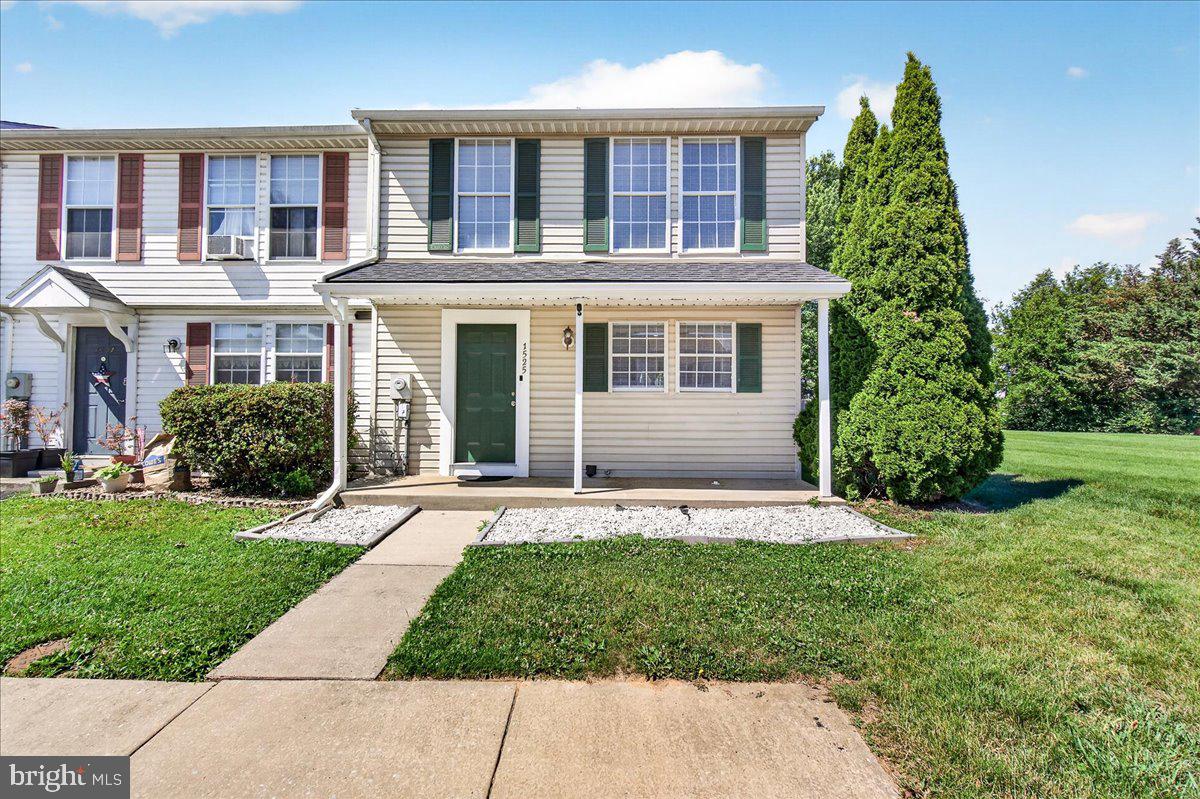 Welcome to Langley East! This beautifully updated, Colonial-style end-unit townhouse offers the perfect blend of modern upgrades and convenience. A new roof (2025) provides peace of mind, while the freshly painted interior features smooth flat ceilings, elegant crown molding throughout the main and upper levels, and new main-level baseboards. Step onto the stylish plank flooring (approx. 2 years old) and enjoy the bright, open feel of new recessed lighting across the main level. The fully remodeled kitchen is a chef's delight, boasting granite countertops, freshly painted cabinets with new hardware, a classic backsplash, and updated recessed lighting. Both the upper and lower bathrooms have been completely remodeled. Additional touches include new door hinges and knobs throughout. Featuring 3 spacious bedrooms and 1.5 baths, this home also offers an unfinished basement, a blank canvas for a gym, playroom, or storage. Outside, enjoy low-maintenance vinyl siding, a private yard, and 2 assigned off-street parking spaces. Unbeatable location close to parks, top schools, transit, shopping, and dining. Truly move-in ready. Schedule your tour today!
