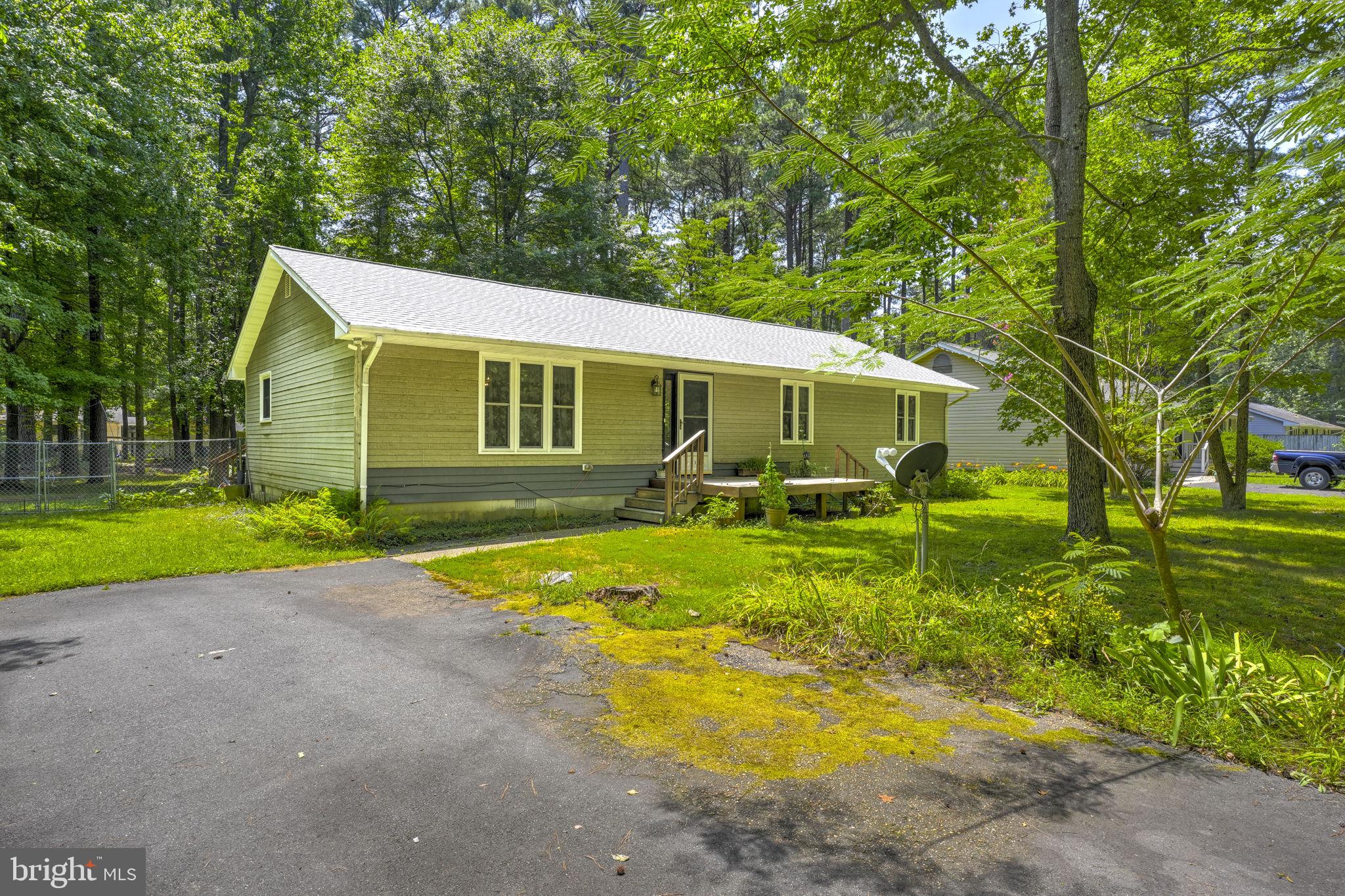 This well-maintained 3-bedroom, 2-bath rambler offers approximately 1,500 square feet of comfortable one-level living on nearly a half-acre lot. The open-concept floor plan creates a functional layout with spacious living and dining areas. The generously sized primary suite features a large bedroom and private en suite bathroom, while the updated hall bathroom adds a modern touch. Enjoy the fully fenced backyard with plenty of space for outdoor activities, along with a rear deck that's perfect for relaxing or entertaining. Additional highlights include a roof that is approximately five years old. Conveniently located with easy access to Pax River Naval Air Station, shopping, dining, and everyday amenities. This home has been well cared for and is ready for its next owner.