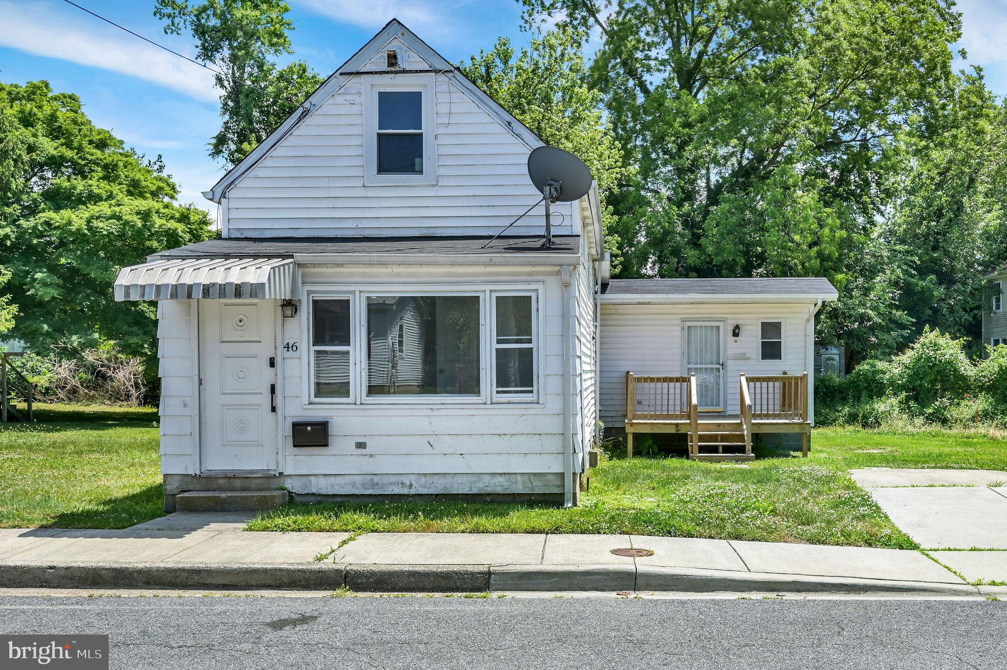 Welcome to 46 Lincoln Street in the heart of downtown Dover! Completely remodeled in 2024, this two-bedroom, two full bath home is truly move in ready and offers effortless modern living from the moment you step inside. Whether you are purchasing your first home, looking to downsize, or seeking a smart investment opportunity, this property checks every box. A rare bonus, the adjoining lot at 50 Lincoln Street is included in the sale, adding exceptional value and providing extra space and flexibility to expand, garden, or simply enjoy additional space to make your own. The main level is bright and inviting, featuring a natural light filled living room with modern luxury vinyl plank flooring and a beautifully updated kitchen featuring granite countertops, soft close cabinetry, and stainless steel appliances. You will also find a spacious main level bedroom, full bathroom, and convenient laundry area, all designed for easy everyday living. Upstairs offers a private second bedroom with its own full bathroom, creating a comfortable retreat for guests, family, or a dedicated home office. Every inch of this home feels fresh, modern, and thoughtfully updated. For added peace of mind, both the roof and mini-split systems were replaced in 2025. Located within walking distance to historic downtown Dover, you will enjoy easy access to parades, festivals, dining, shopping, and everyday conveniences. Hospitals, healthcare facilities, schools, universities, and public transportation are all just minutes away. Take advantage of this opportunity-you will be glad you did! Taxes, square footage, and room sizes are estimated. Buyers are to perform their own due diligence.
