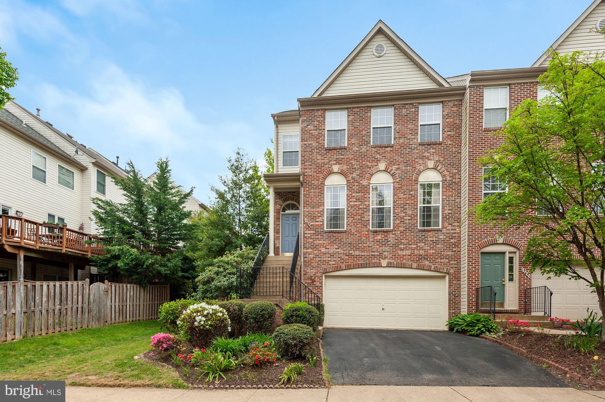 Large Brick Front End Unit with Updated Hardwood Floors, New Paint, New Carpet and New A/C.  Large Open Concept Kitchen with Granite Counters, Tile Backsplash, Stainless Steel Appliances, New Refrigerator,  New Microwave, Recessed Lighting, Breakfast Bar with Pendant Lighting, and Hardwood Floors.  The Kitchen is open to the Spacious Family Room with Gas Fireplace and Breakfast Area.  The Large Deck is accessed from the Breakfast Area.  Half Bathroom on the Main Level.  The Living Room has a Large Built-in Display Nook with Glass Shelving and Accent Lighting.  The Dining is Open to the Living Room and has a Large Bay Window and Hardwood Floors.  Crown Molding in the Living and Dining Room. Windows on Three Sides provide lots of Sunlight.  Huge Primary Bedroom with New Hardwood Floors, Vaulted Ceilings, Walk-in Closet and Separate Closet, and Wood Blinds.  The Primary Bathroom has A Dual Sink Vanity, Large Soaking Tub and Separate Walk-in Shower.  The Second Bedroom has Vaulted Ceilings and a Walk-in Closet.  The 3rd Bedroom also has Vaulted Ceilings.  Hall Bathroom with Tile Flooring and Long Rectangular Window in the Shower/Tub Combo.  Gigantic Recreation Room with Crown Molding, Gas Fireplace, and Walk Out to the Stone Patio and Fenced Backyard.  Room for Planting Vegetables.  New Energy Efficient Windows.  2 Car Garage with Shelves for Storage and Separate Storage Room in the Garage.  A Well Landscaped Lot with Azaleas, Hydrangea, and Rhododendron.  Backs to Mature Trees.   12 minute Stroll to Fairfax Town Center with Safeway, Restaurants, Retail and Regal Cinemas.  1.3 miles to Whole Foods and Starbucks.  Also near Fair Lakes Promenade, Fair Oaks Mall, Costco, Home Depot and Wegmans.  Only 1 pet allowed on a case-by-case basis.