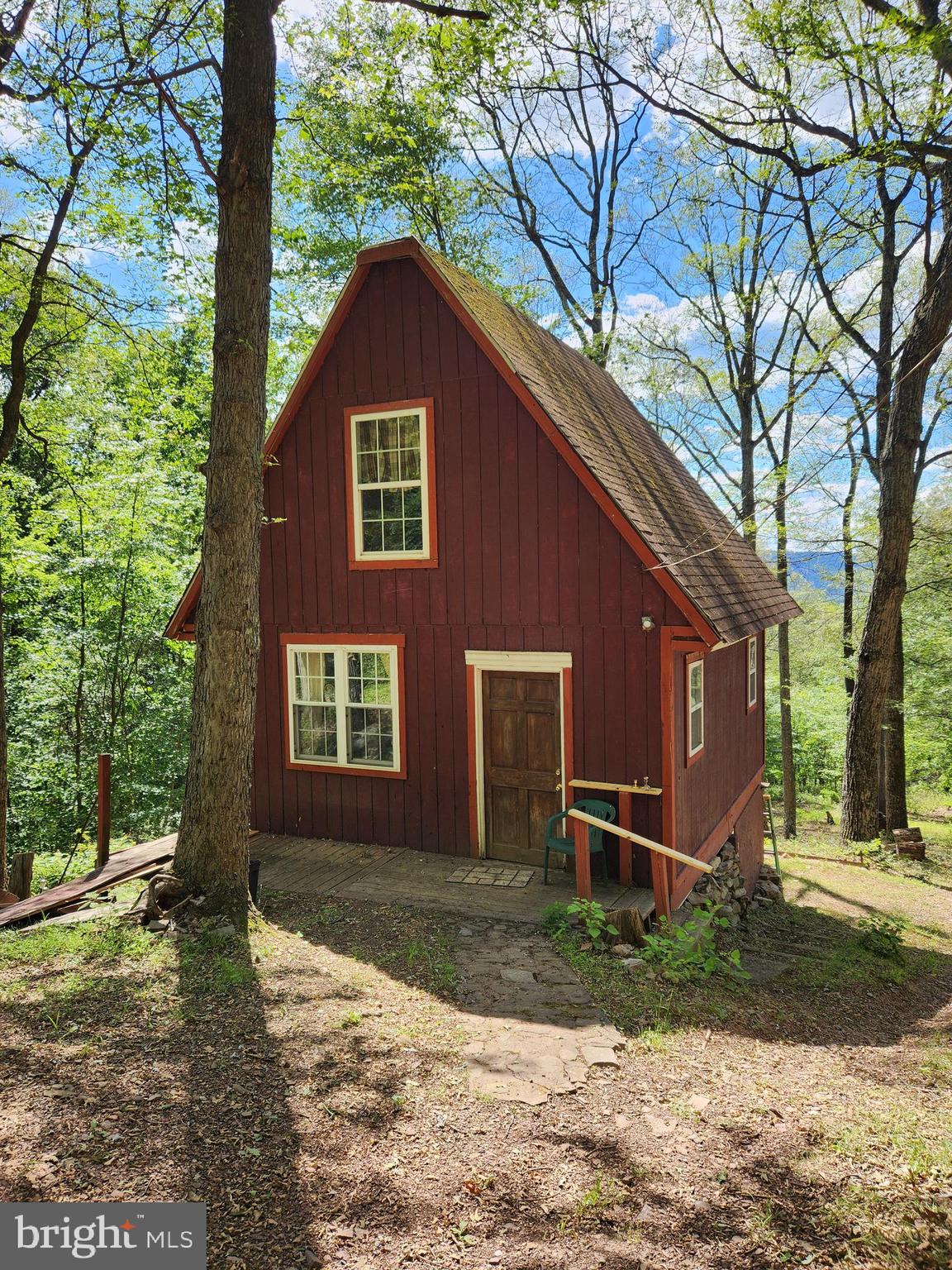 Rustic Off-Grid Cabin Nestled on 9.27 Acres
Escape to your secluded haven with this charming off-grid cabin, nestled amidst 9.27 acres of pristine wilderness. Perfectly suited for a tranquil vacation getaway, an adventurous hunter's retreat, or the canvas for your dream home, this property offers a rare blend of privacy and natural beauty.
Key Features:
Open Floor Plan: The cabin boasts an inviting open floor plan, accentuated by a cozy wood stove in the living room, ideal for warming up on chilly evenings.
Loft Bedroom: Ascend to the loft bedroom, offering ample space for a king-sized bed and boasting panoramic views of the surrounding wooded landscape and mountains.
Functional Kitchen: The kitchen has older yet fully operational appliances, providing everything you need to whip up delicious meals.
Full Bathroom: Enjoy personal comforts with a full bathroom featuring a semi-composting toilet and a shower.
Scenic Deck: Step outside onto the deck and immerse yourself in the breathtaking vistas of the lush forest and distant mountains.
Outdoor Delights: Explore the property's enchanting features, including walking trails, terraced raised garden beds, a huckleberry patch, wineberries, and wild grapes.
Abundant Wildlife: Encounter the wonders of nature with a diverse array of wildlife, from deer and turkeys to squirrels and the occasional black bear.
Water System: Benefit from a gravity-fed water system with a 1,100-gallon holding tank, supplying water to the kitchen sink, bathroom sink, and shower. Yes, you can have a hot shower!  The holding tank can be filled by the spring-fed seasonal stream or you can have water delivered. The seasonal stream is typically running spring, fall & winter months.
Electricity: While electric service is available to the property, it requires restoration by the electric company at the buyer’s expense. Alternatively, utilize the hook-up for a generator (generator not included) for power needs.
Privacy and Security: The property features a locked security gate at the entrance of Lonesome Pine, ensuring utmost privacy and security.
Don't miss the opportunity to experience the serenity and charm of this rustic off-grid cabin firsthand. Schedule your private showing today and embark on a journey to nature's paradise. Financing options will be limited but a 203k renovation loan may be something to consider.  Otherwise, this will need to be a cash transaction. 
NO DRIVE BYS-Shown by appointment only. There is a locked security gate at the beginning of Lonesome Pine.   It is highly recommended to park at the top of the driveway by the road or have a 4x4 to drive down the driveway. Do not attempt the driveway without a 4x4!