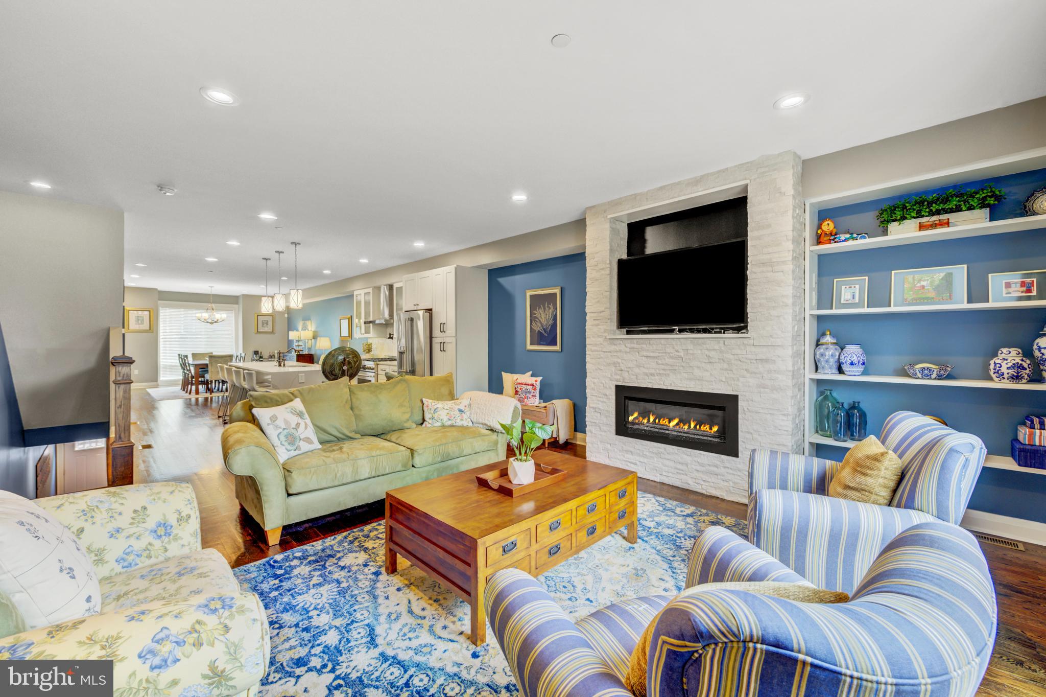 Located in the coveted Art Museum Area, this stunning contemporary townhome offers the perfect blend of luxury, sophistication and city living. Built in 2017 and thoughtfully upgraded throughout, this elegant four story residence boasts expansive living space, breathtaking skyline views and the very rare convenience of an oversized two car garage. 
Step through the grand foyer and immediately appreciate the gleaming oak hardwood floors that flow throughout the home. The entry level features a spacious family room with custom built-in shelving, recessed lighting, a convenient powder room, abundant storage and direct access to a two car oversized garage.
Designed for both everyday living and entertaining, the open-concept main level is truly spectacular! The inviting living room showcases custom built-in bookcases, a dramatic stone gas fireplace and sliding glass doors opening to a large   private deck- perfect for outdoor dining! At the heart of the home is a chef's dream kitchen featuring upgraded cabinetry, quartz counter tops, stainless steel appliances, pendant lighting, a pot filler over the stove and an oversized island with seating for four. The elegant dining area, bathed in natural light through the floor to ceiling window, is the perfect space to host memorable dinner parties beneath a stunning chandelier.
The next level offers two spacious bedrooms, including a private guest suite with recessed lighting, ceiling fan, generous closet space and a beautifully tiled ensuite bath.  An additional large bedroom, full hall bath with upgraded finishes, laundry room with full sized washer& dryer and an enormous storage room complete this floor.
The luxurious primary suite level is a true retreat reminiscent of a five-star resort! The serene primary bedroom features a floor to ceiling stone gas fireplace, creating warmth and ambiance, while the spa-inspired bath offers a soaking tub, oversized double shower, elegant double vanity with designer cabinetry and a private water closet.  A  custom walk-in closet with built-in shelving  and drawers adds exceptional convenience and style. A fourth bedroom completes this level. 
Crowning this extraordinary home is an expansive rooftop deck with breathtaking panoramic views of Center City Philadelphia. Whether hosting unforgettable parties or relaxing under the city lights, this incredible outdoor space provides the ultimate urban backdrop!
Perfectly situated just steps from premier dining, shopping, and public transportation and within walking distance to iconic destinations and historical landmarks including the Barnes Foundation, Philadelphia Museum of Art and the Rodin Museum, this exceptional residence offers luxury city living at its finest. Convenient to Center City, 30Th Street Station, major highways and bridges, and all the fun and culture  the City of Brotherly Love has to offer!  ** Time left on Tax Abatement.