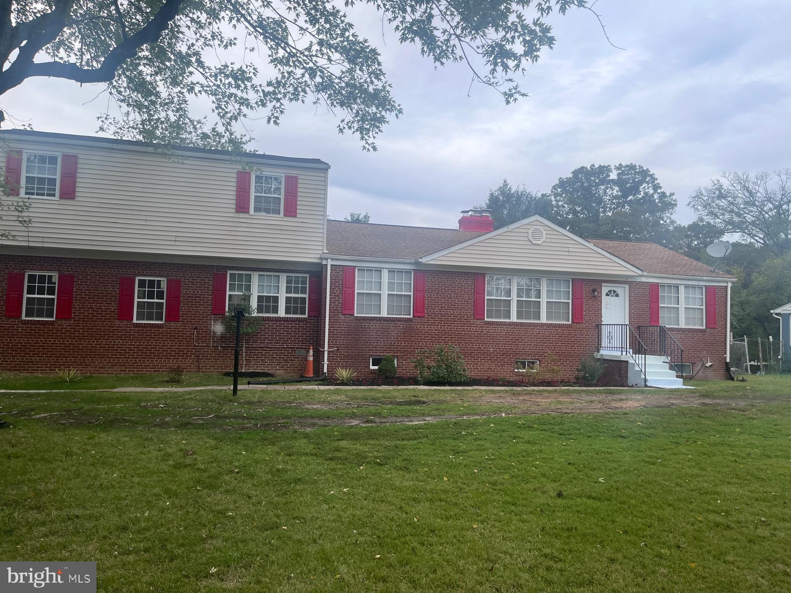 This large 3 level all brick home features 2 main level bedrooms, 1 full bath, living room w/fireplace, upper level loft w/sitting room, bedroom and full bath. The lower level has rec room bar, bonus room, 1 car garage. Wooded lot with backyard brick grill.
