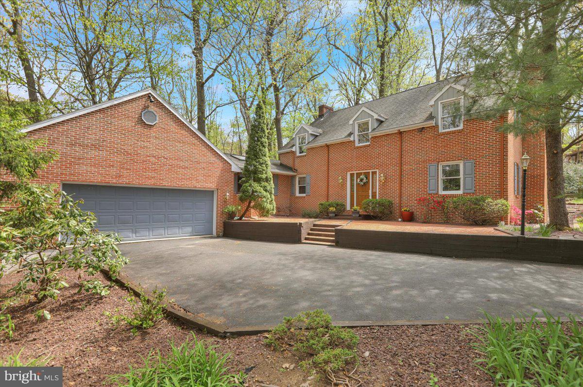 Welcome to 13 Nassau Circle, a stunning all-brick home nestled within the highly desirable Flying Hills community! This spacious 4-bedroom, 2.5-bath residence offers a distinctive floor plan filled with character, generous living spaces, and a private setting backing to lush woodlands.
Upon entering, you'll be greeted by a sunken formal living room that creates an elegant and inviting atmosphere. The main level also features a dedicated formal office, perfect for today's work-from-home lifestyle, as well as a comfortable family room highlighted by a beautiful stone fireplace. The kitchen area impresses with its cathedral-style ceiling, creating an open and airy feel that's ideal for both everyday living and entertaining.

The recently renovated finished lower level provides exceptional additional living space and showcases new luxury vinyl plank flooring, fresh paint throughout, and a stylish bar area—perfect for hosting family and friends, creating a game room, or enjoying movie nights at home.

Step outside to the expansive rear deck where you can relax and take in the peaceful wooded backdrop, offering a rare sense of privacy and tranquility.

Additional features include a 2-car garage, spacious bedrooms, and all the amenities and charm that make Flying Hills one of the area's most sought-after communities. Conveniently located close to shopping, dining, golf, and major commuting routes, this exceptional property is truly a must-see!
