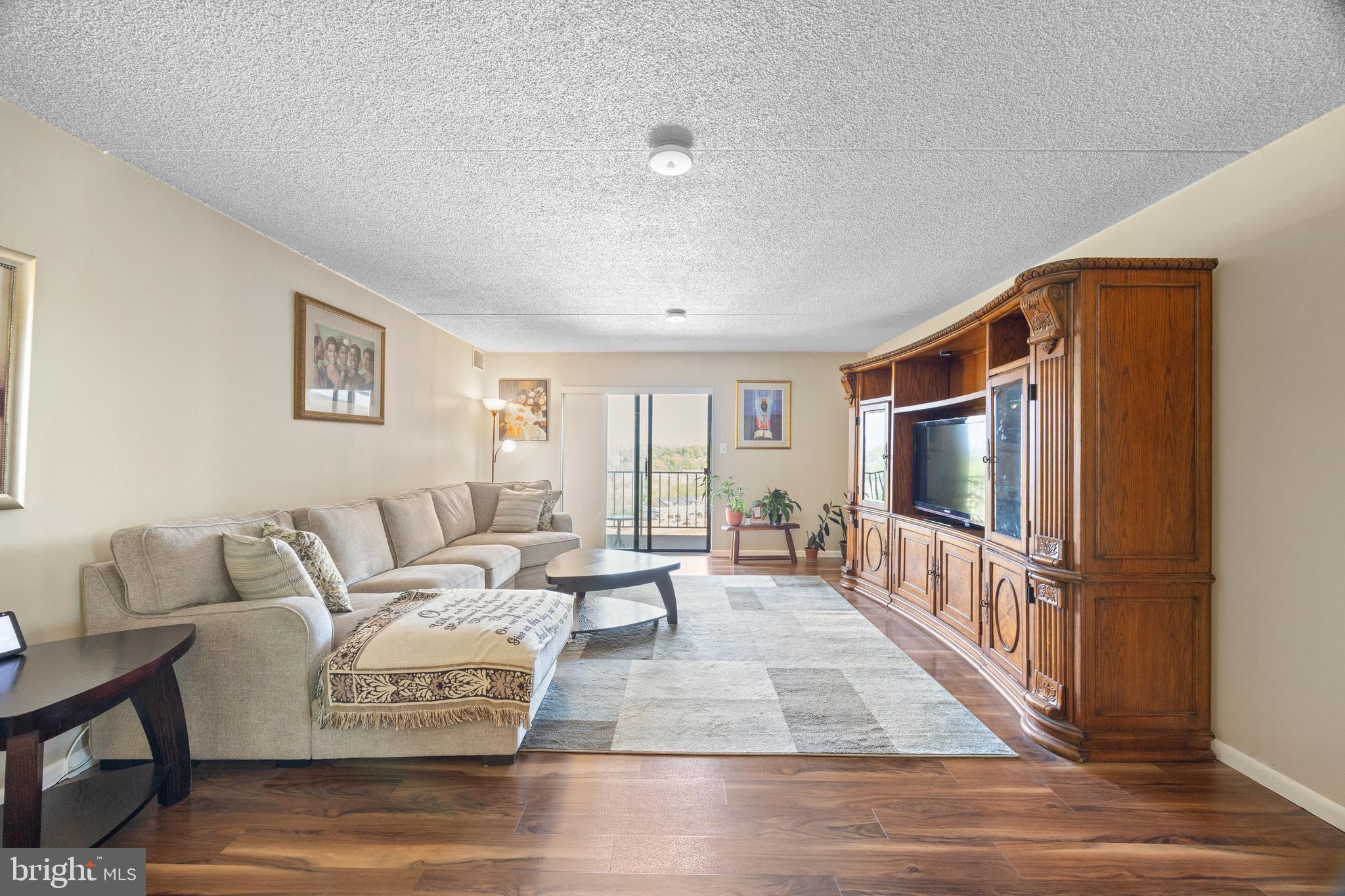 Welcome to 20933 Valley Forge Circle, a beautifully maintained 2 bed, 2 bath condominium in the highly sought-after 2000 building at Valley Forge Towers, ideally located in the heart of King of Prussia. Step inside to find a bright and inviting living and dining area, where natural light pours in through sliding glass doors that lead out to your private balcony overlooking the Schuylkill River. The open layout creates an easy, comfortable flow for everyday living and entertaining. The updated kitchen features granite countertops, stainless steel appliances, and a functional layout that connects seamlessly to the main living space. One of the standout features of this home is the expansive balcony that spans the full length of the unit, with three separate sliding door access points located in the living room and both bedrooms. Whether you’re enjoying your morning coffee or winding down at the end of the day, this outdoor space offers peaceful river views and an extension of your living area. Down the hallway, the spacious primary suite includes ample closet space and a private en suite bathroom. The second bedroom, complete with newer carpeting, is ideal for guests, a home office, or additional living space. An updated full hall bathroom, in-unit laundry, and a dedicated storage unit just down the hall add to the home’s convenience and functionality. The monthly condo fee covers a wide range of utilities and services, allowing for truly low-maintenance living, and includes access to an impressive list of community amenities. Residents of Valley Forge Towers enjoy indoor and outdoor pools, a fitness center, tennis courts, clubhouse, and 24/7 security, creating a lifestyle that blends comfort, convenience, and community. Situated just minutes from King of Prussia Mall, King of Prussia Town Center, and Valley Forge National Historical Park, with easy access to Routes 422, 202, I-76, and the PA Turnpike, this location offers unbeatable accessibility to shopping, dining, recreation, and commuting routes. Move right in and enjoy a home that combines space, updates, and an amenity-rich lifestyle in one of the area’s most convenient locations.