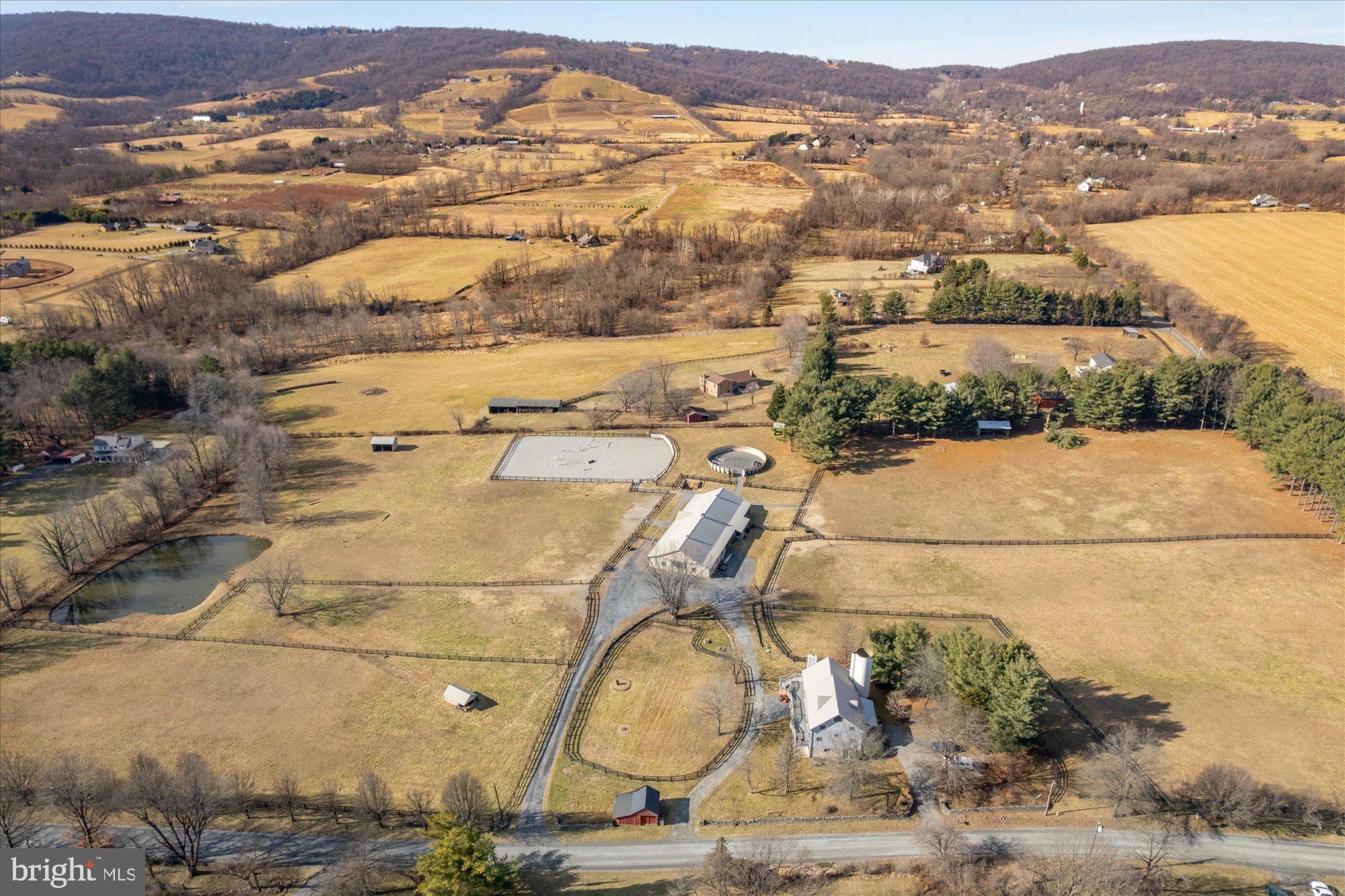 Bank barn conversion home with 3 levels, 4/5 BR, 3 BA, attached silo and stunning western views. Old beams and hardwood floors throughout. Lower level has separate entrance and potential for in-law, nanny or working student suite,

Custom 10 stall barn lined with reclaimed fence boards and knotty pine. Vaulted ceilings. 14x14 stalls with Lucas fixtures. Wash stall, heated tack/feed rooms, heated lounge with bathroom and large indoor storage for hay, machinery or additional stalls. Round pen, ring, run in sheds, many paddocks. A wonderful homestead for the horse enthusiast or professional equestrian facility.

NO HOA. NO EASEMENTS. ZONED AR-1

Available for showings with 48 hours notice. Lister must accompany.  Seller not responsible for roll back taxes.
