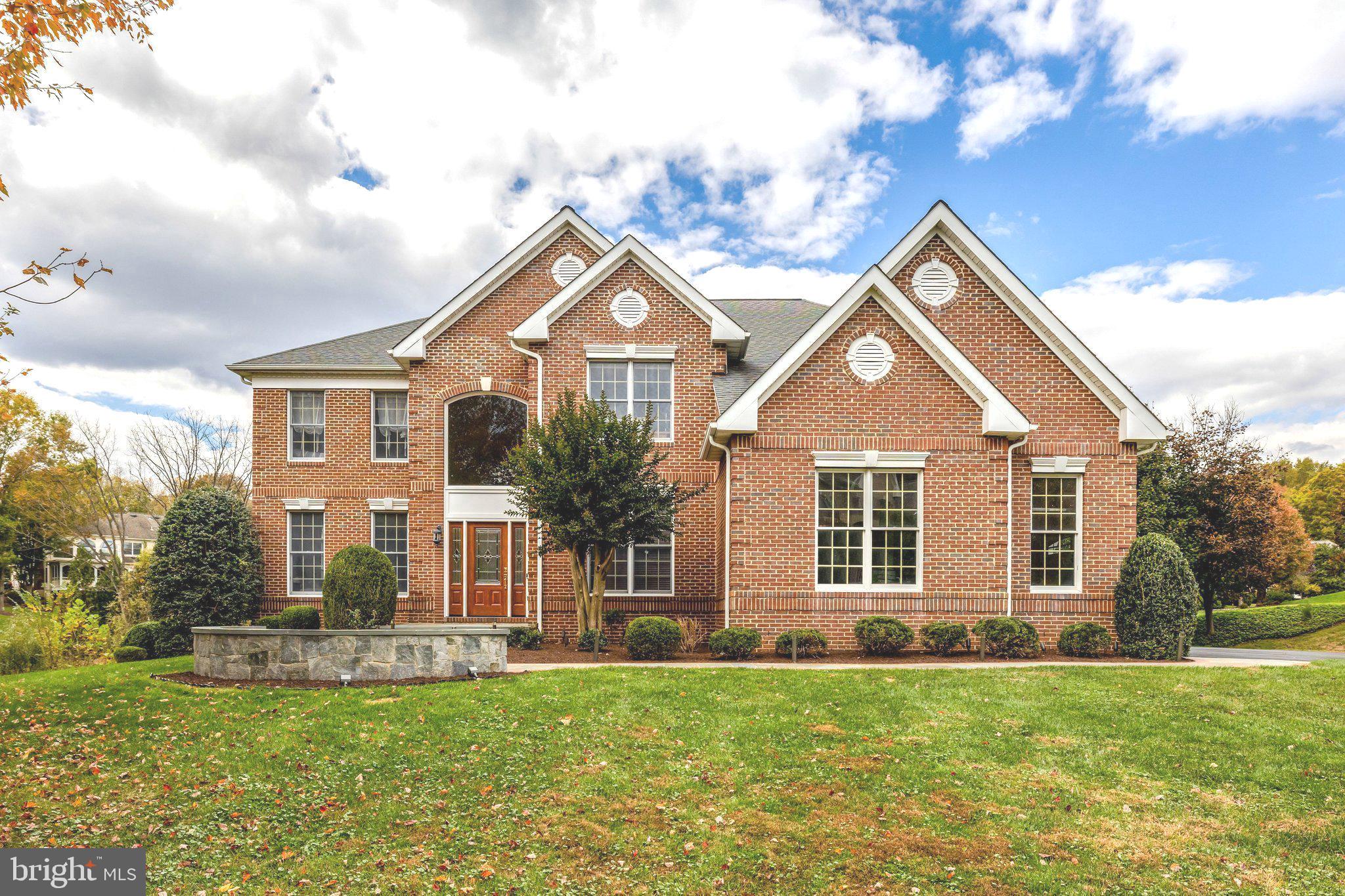 Over 800K in Updates! Situated on a premier .60-acre cul-de-sac lot backing to mature woods, this exceptional 5-bedroom, 4.5-bath colonial offers over 5,800 square feet of beautifully updated living space in sought-after Hunter Mill Estates. A light-filled, open floor plan defines the main level, featuring a private office, elegant living and dining rooms, and a dramatic two-story great room with a gas fireplace that anchors the home with warmth and architectural presence. Designed for both everyday living and refined entertaining, the spaces flow seamlessly together. The fully renovated chef’s kitchen is appointed with granite countertops, Sub-Zero refrigeration, Wolf double ovens with griddle and grill, Wolf microwave, Miele dishwasher, built-in under-counter refrigeration, and refined finishes throughout. Rich hardwood floors span the foyer, kitchen, and upper level, complemented by architectural details including a coffered family room ceiling and custom shiplap accents. Designed for exceptional indoor-outdoor living, the home showcases a stunning screened porch with vaulted ceilings and a fireplace, an expansive deck overlooking the wooded backdrop, and professionally landscaped grounds that frame the property beautifully. The upper level offers four spacious bedrooms, including a luxurious primary suite complete with a private dressing room and a spa-inspired bath renovation featuring dual vanities, a soaking tub, and a luxury shower—creating a true private retreat. The walk-out lower level expands the home’s versatility with a fifth bedroom and full bath, recreation area, game room, custom bar, generous storage, and direct access to the backyard—ideal for entertaining, guests, or multigenerational living. Additional major improvements include a whole-house generator updated major systems, hardwood flooring enhancements, updated powder room, recessed lighting throughout, and replaced garage doors. Residents of Hunter Mill Estates enjoy neighborhood access to Hunter Mill Swim & Racquet Club, along with direct connectivity to the Washington & Old Dominion paved trail and the wooded Fairfax Cross County Trail—offering an exceptional lifestyle of recreation and community. Meticulously maintained and positioned on one of the neighborhood’s premier lots, this residence offers privacy, sophistication, and enduring value in one of Vienna’s most desirable communities.
