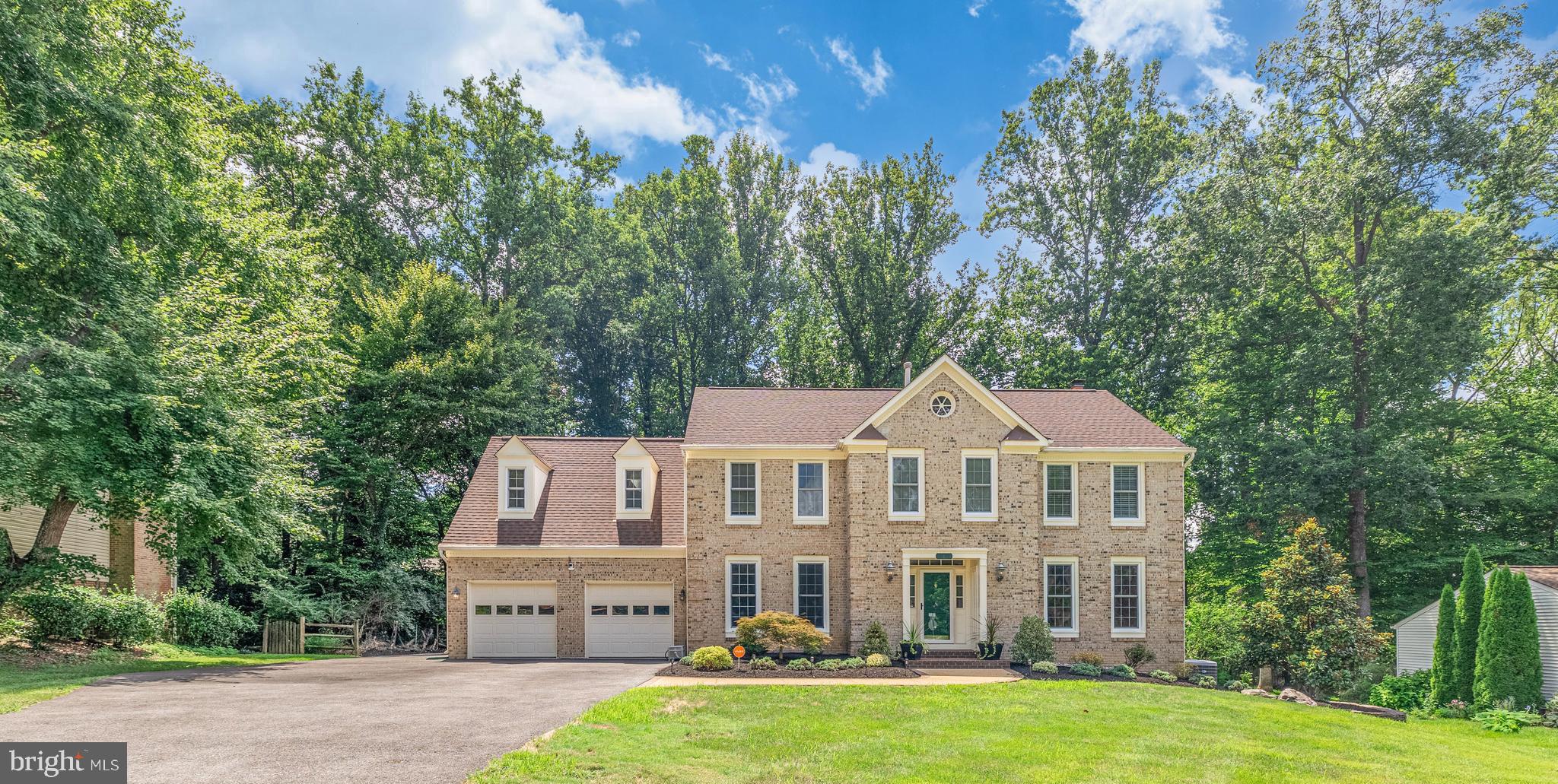 This luxury home commands attention on a lush, nearly half acre enclave in Fairfax’s prestigious North Hill, marrying timeless elegance with modern sophistication.   Its stately façade, meticulous landscaping and architectural integrity captures you at its curb appeal and draws you to its interior.
 
Cross the threshold, where an open, thoughtful layout gleaming wood flooring and refined finishes await – each room poised to host gatherings with family and friends.
 
The gourmet kitchen is  an entertainer’s dream, with an expansive island with room for 6 barstools,  separate coffee bar and a separate bar area, top-of-the-line stainless steel appliances including a gas Wolf, 6 burner w/ griddle double oven, under counter icemaker, 2 dishwashers, 2 sinks, granite countertops, floor-to-ceiling custom cabinetry and more.    Just off the kitchen, enjoy built-ins that offer a convenient office space with tons of natural light.
 
The serene, large screened in porch off the spacious eating area of the kitchen it a great place to enjoy your morning coffee.   It leads out to a large deck with a gas-line fed, large Weber grill, to enjoy alfresco dining.
 
The home boasts 6 bedrooms and 5.5 baths, three of which are ensuite.  The master bathroom includes a steam shower and heated floors.   A 7th bedroom off the master suite was converted into an expansive California closest, while the in-law suite on the main level has a walk in tub, separate den area with sink and refrigerator and its own private entrance.
 
In addition to the first floor in-law-suite, the main level layout offers seamless flow and endless options including a family room with a wood-burning fireplace, a formal living room, a dining room, a spacious eating area off the kitchen, half bath and laundry room as well as a huge pantry.  
 
Venture to the walk out basement – where your bright, freshly painted and carpeted recreation room is perfect for entertaining with a wet bar, while enjoying the hot tub on the covered patio.   Take advantage of the huge storage room that can be converted to any space you may desire.    The two-car garage also provides ample room for storage.
 
Recessed lighting, crown molding, skylights, new carpeting and fresh paint are just a few more touches that make this elegant home have such appeal.  HVAC includes 4 zones for optimum comfort.   The windows and one of the HVACs are less than 10 years old.  1 HVAC is less than 3 years old.  The main level is handicap accessible.
 
Outdoors, the property blooms.  Mature trees lace the rear yard that is partially fenced (electric for pets), and the deck, patio, hot tub and back screen porch make the perfect sanctuary.  
 
Enjoy more than just a home – take advantage of easy access to schools, esteemed neighborhood amenities, and major commuter routes for seamless connection to DC and beyond.   Nestled in the peaceful and polished North Hill community, this is an opportunity to own a home that balances enduring beauty with exceptional location.   Schedule a tour of 10821 Fieldwood Drive today!