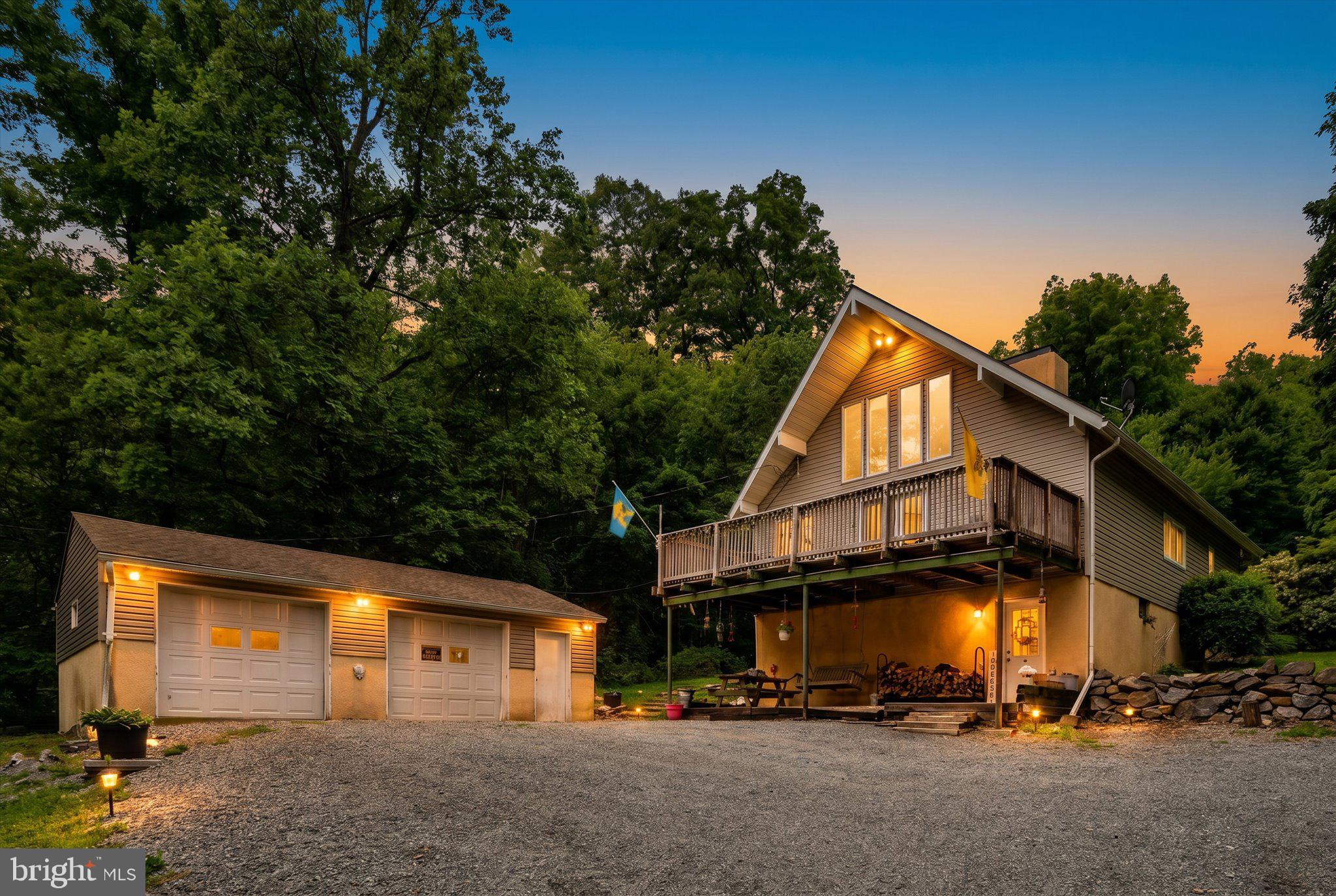 Tucked high in the woods on a little over 4 ¼ acres, this unique A-Frame retreat offers privacy, character, and breathtaking views overlooking a sprawling apple orchard. Access to the property is truly one-of-a-kind, as you drive through the scenic orchard before arriving at this secluded hillside setting surrounded by nature. 190 Poplar Road offers the perfect opportunity for buyers seeking a peaceful escape with room to make it their own. The home features a warm and inviting layout with two bedrooms and a full bathroom on the main level, plus an additional private bedroom on the upper floor. A large wood-burning stove serves as a stunning focal point and has the capability to heat much of the home, creating a cozy cabin-like atmosphere during the colder months. Step outside onto the expansive front deck and take in the incredible elevated views of the orchard and surrounding countryside, the perfect spot for morning coffee, wildlife watching, or relaxing evenings in the fresh mountain air. The property also includes an oversized detached two-car garage with ample space for vehicles, storage, hobbies, or workshop needs. With its desirable acreage, unique architectural style, and unforgettable setting, this property offers endless potential for someone looking to add their own personal touches while enjoying the beauty and tranquility of country living.
** Sale is contingent on sellers establishing new home **