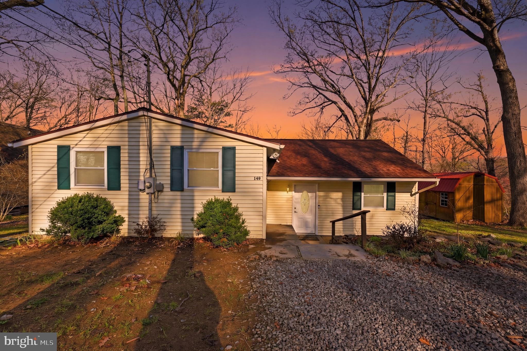 Tucked away in a peaceful, wooded setting just 2.5 miles from public access to the Shenandoah River, this split-level home offers a great mix of comfort, space, and nature. The spacious backyard backs to trees, creating a private setting to relax or entertain.

Step inside to vaulted ceilings throughout the home, creating an open and airy feel. The kitchen features new appliances and plenty of space for everyday living, with a 21x7 screened-in porch just off the dining area—perfect for enjoying your morning coffee or winding down in the evenings.

The primary bedroom includes its own half bath, along with 2 other spacious bedrooms offering flexibility for guests, family, or a home office. Downstairs, a finished flex space can be used as a rec room, gym, or additional living area.

Recent updates include a new roof (2024), double-hung windows, a water softener, and an active radon mitigation system. Outside, you’ll also find a 16x10 shed with loft storage and a large gravel driveway with plenty of parking. Enjoy peaceful living with easy access to the Shenandoah River—just in time for the summer!