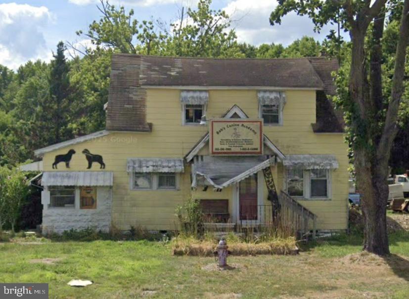 Investor  Opportunity with Development Potential! 3-bedroom, 1-bath home offers endless possibilities for investors, renovators, or developers. The property is in need of rehabilitation and is being sold as-is, making it an excellent opportunity to restore, redevelop, or build equity. Previously operated under a conditional commercial use as Bob's Canine Academy, the property has a history of commercial use while currently being zoned residential. With nearly 2 acres, there is also subdivision potential (subject to governmental approvals).
