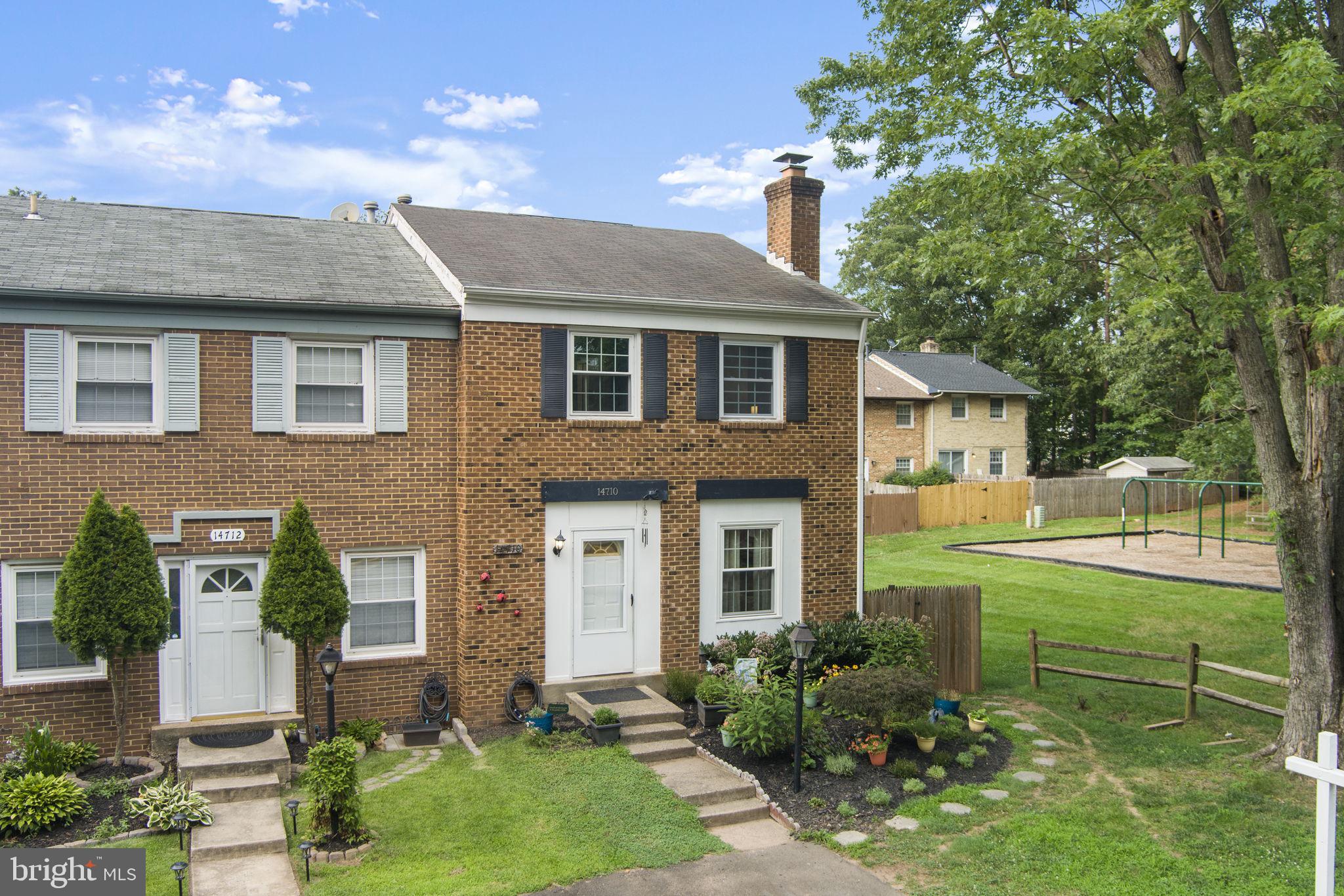 Stylish all brick end-unit townhouse: 3 bedroom, 2 full/2 half baths across 3 beautifully designed levels with approximately 1860 sq ft of living space.  Large rec room with wood burning fireplace on lower level with additional bonus 4th bedroom/den!  Right next to green space and playground and steps to the elementary school! Featuring eat in kitchen, hardwood floors, and a finished basement perfect for entertaining. Three parking spots, 1 driveway, 1 assigned, and one permit parking pass! Enjoy premium privacy backing directly green space with miles of scenic trails and oversized lot for outdoor relaxation.  Perennials in beautiful flower garden! Centreville Park and Ride Lot is 2 blocks away with bus transport to Vienna Metro Station, providing easy access to Washington D.C. Local grocers are Trader Joe’s, Wegmans, and Giant, with Costco, Walmart, and Target. Fine & casual dining along with shops and all the conveniences at your fingertips. Surrounded by miles of walking trails and bike paths, wild flowers and water crossings in the Cub Run Stream Valley Park as well as being on the cusp of the Manassas Battlefield and Bull Run Regional Park. Convenient to Centreville Library, the Multiplex theater, 2 golf courses, Cub Run Rec Center, Dulles Expo Center, Fairfax County Parks and the Winery at Bull Run. London Towne community enjoys 2 playgrounds a few blocks from the front door. The perfect size and well spaced floor-plan with modern convenience in a prime location!
