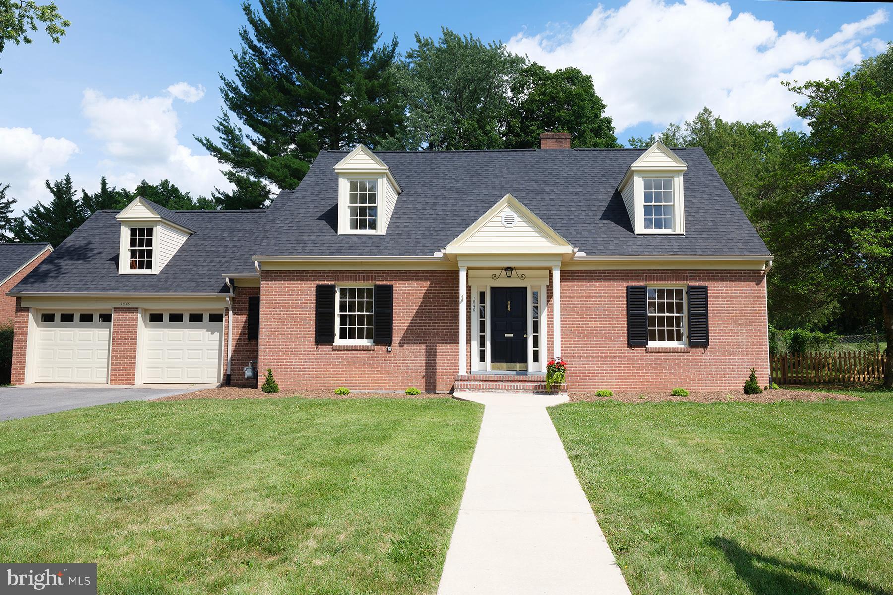 Charming all brick cape cod  sitting pretty on this beautiful tree lined street.  Hardwood floors.  Large rooms First floor family room with built ins. Freshly painted neutral decor throughout.    Renovated gourmet kitchen with granite counter tops.  Stainless steel appliances.  Three bedrooms two and a half baths.  Great floor plan.  Living   room over looking large covered back porch.  Enjoy the terraced back yard fenced in just perfect for kids and dogs.  Attached two car garage. Right off of the kitchen Take an evening stroll  sidewalks and Historic street lights.   Convenient to shopping, and did I say walk to Gordons Groceries for a great crab cake.   Move right in!