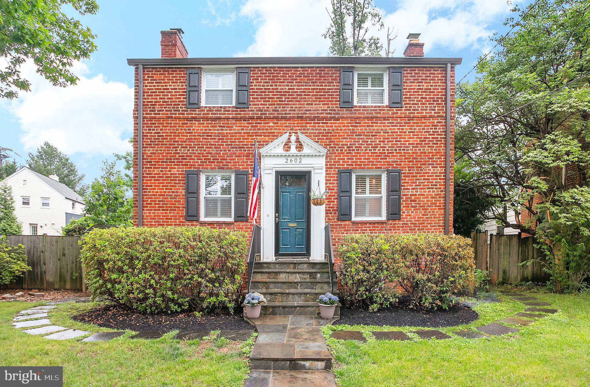 FIRST OPEN HOUSE SUNDAY, MAY 31ST FROM 2:00PM-4:00PM! Welcome to this beautifully updated brick home, on an expansive lot, in the coveted Rock Creek Forest section of Chevy Chase. This charming colonial showcases a thoughtfully designed interior with modern updates throughout. Set on a picturesque, tree-lined street, the property welcomes you with classic curb appeal and a warm inviting presence. The main level offers a traditional and open layout perfect for entertaining or a quiet night in. The renovated kitchen is ideal for any at-home chef or family enjoying the open kitchen/dining layout. Featuring beautiful cabinetry, stainless steel appliances, tile backsplash, and quartz counters, no detail has been overlooked. The living room is lovely, and is anchored by a wood burning fireplace and charming built-ins. The living room connects to a bright sunroom, with brick accent wall, and functions as a perfect office or den space. 
Upstairs you will find three generous bedrooms with thoughtful separation that supports privacy, and the primary suite offers a walk-in closet for ample storage. The hall bathroom has been renovated and includes stunning tile work, new vanity, and a soaking tub. The finished basement is very spacious and includes an additional renovated full bathroom with convenient laundry. Outside is a private retreat—a lush flat backyard with a gorgeous flagstone patio and storage shed. Located in the sought-after Bethesda-Chevy Chase (B-CC) High School district, you are moments away from Rock Creek Park trails, Norman's Farm Market, Meadowbrook Stables, Candy Cane City Park, and the iconic Parkway Deli. Enjoy easy access to Beach Drive, the Beltway, and downtown Bethesda and Washington, DC.